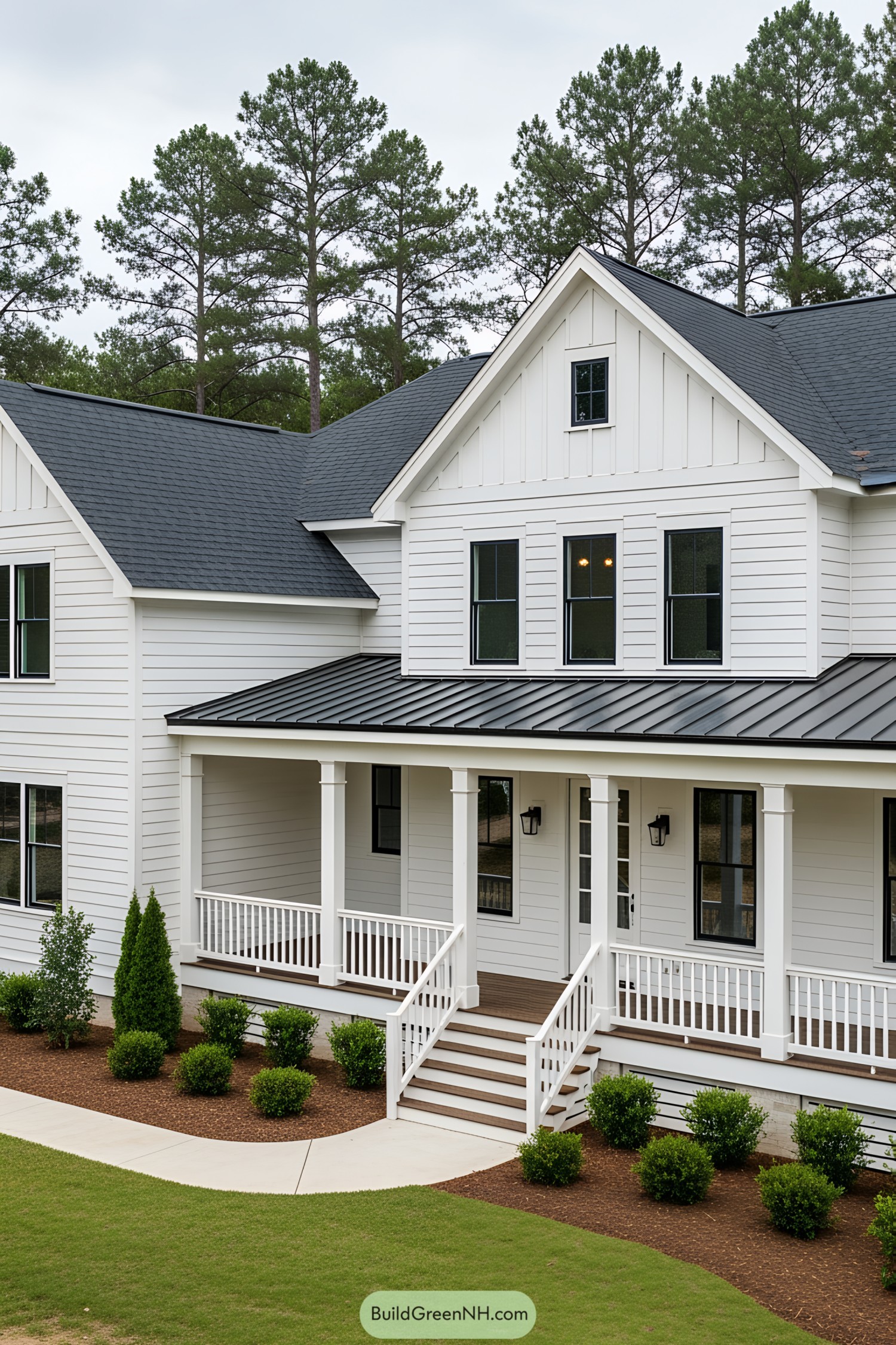 White farmhouse with charming porch and green surroundings