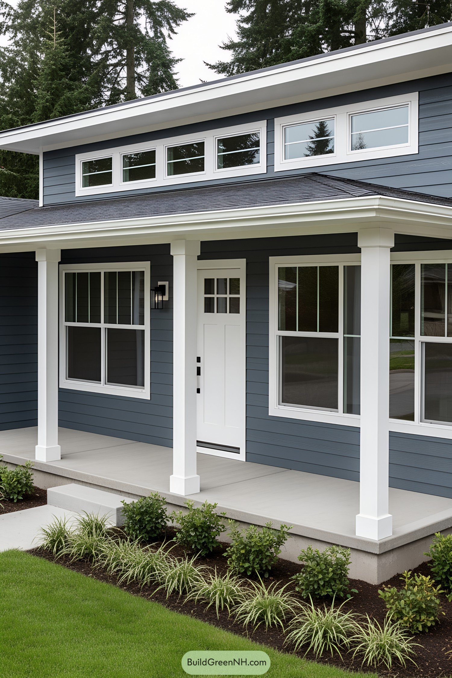 Front porch with classic white posts and blue siding