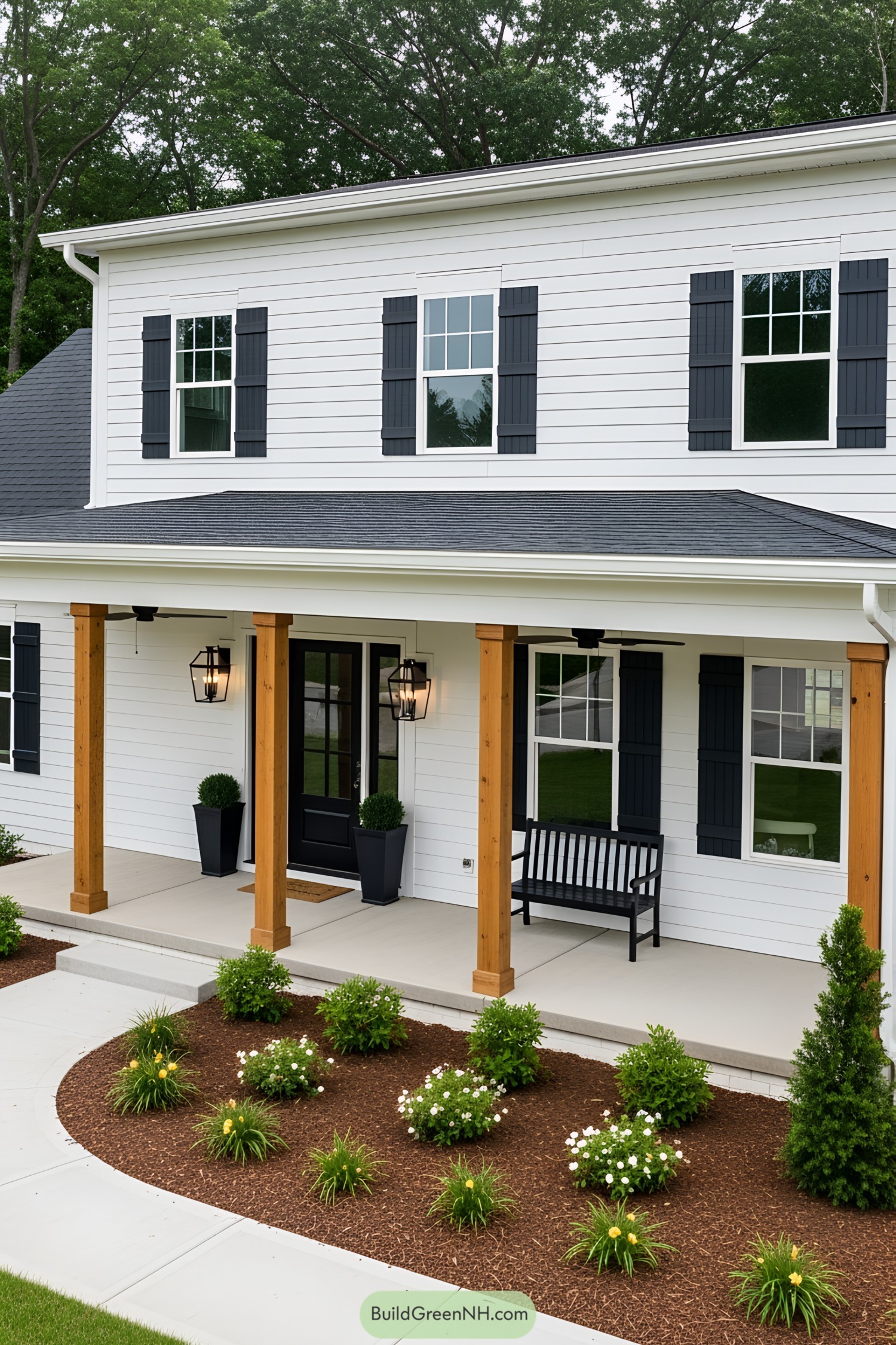 Wooden pillars and a cozy black bench on a front porch