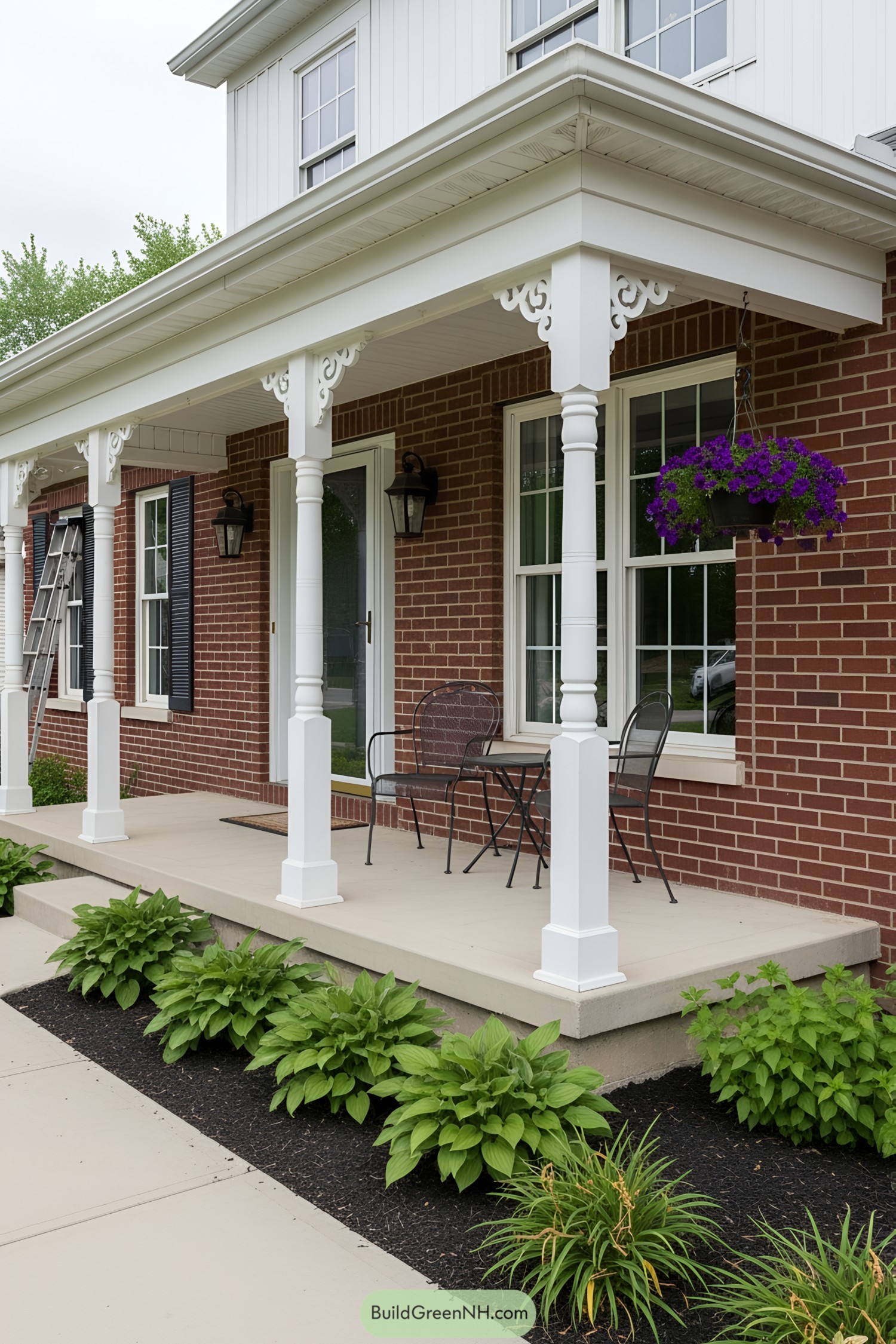 Front Porch with White Posts and Brick Wall