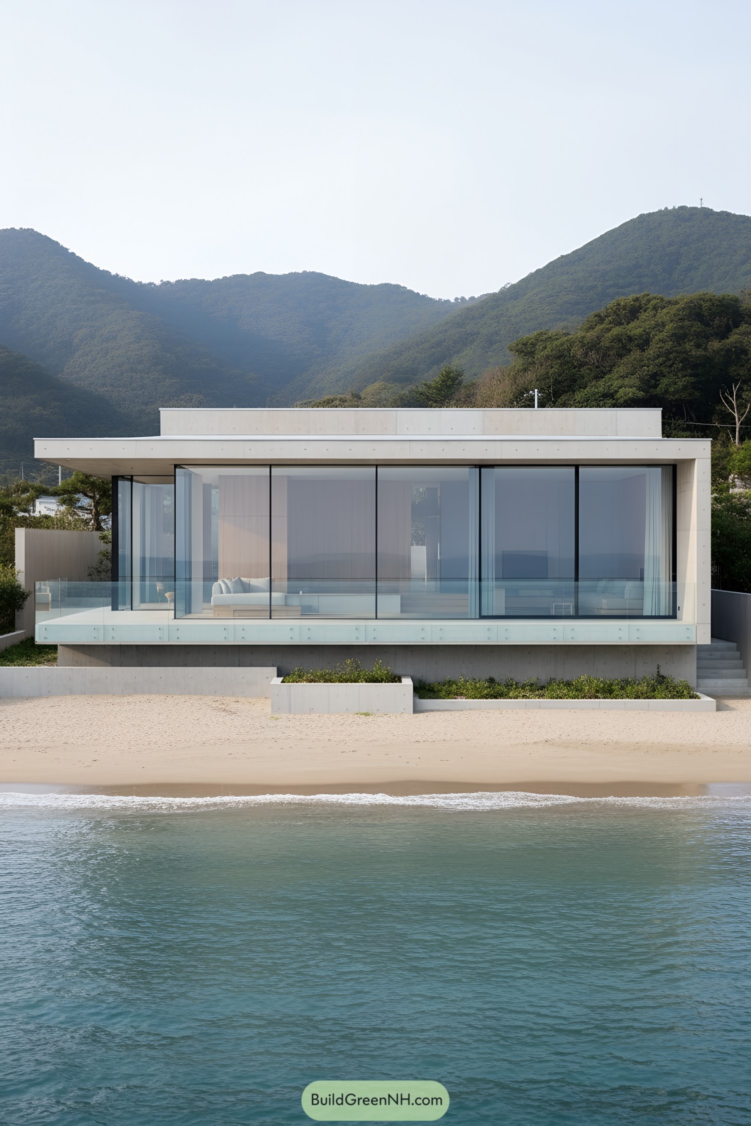 Modern beachfront house with large glass windows