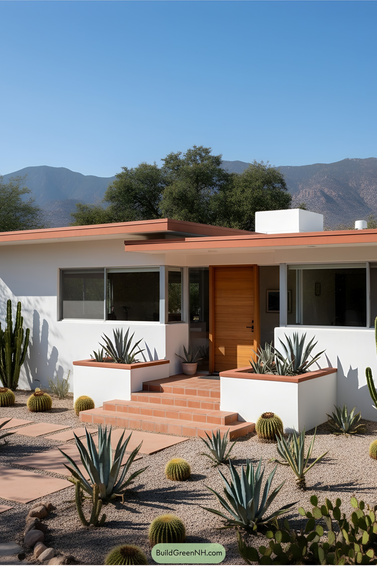 Mid-century modern house with cacti and mountains