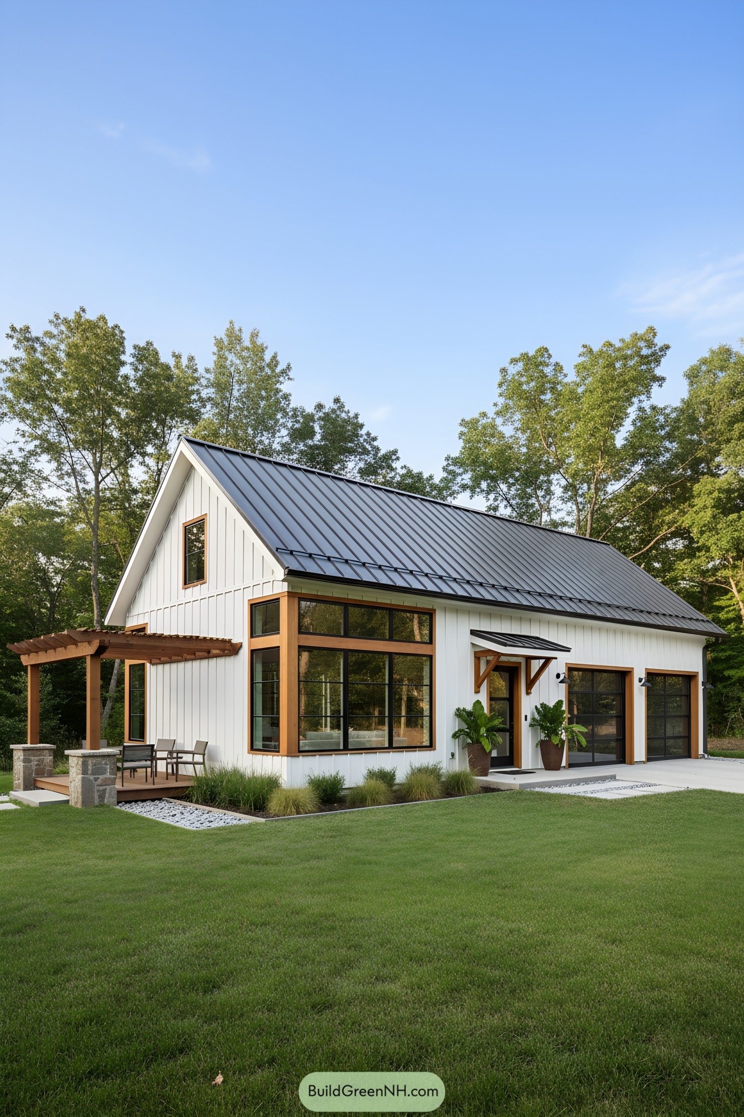 Sleek modern barn with large windows and a patio