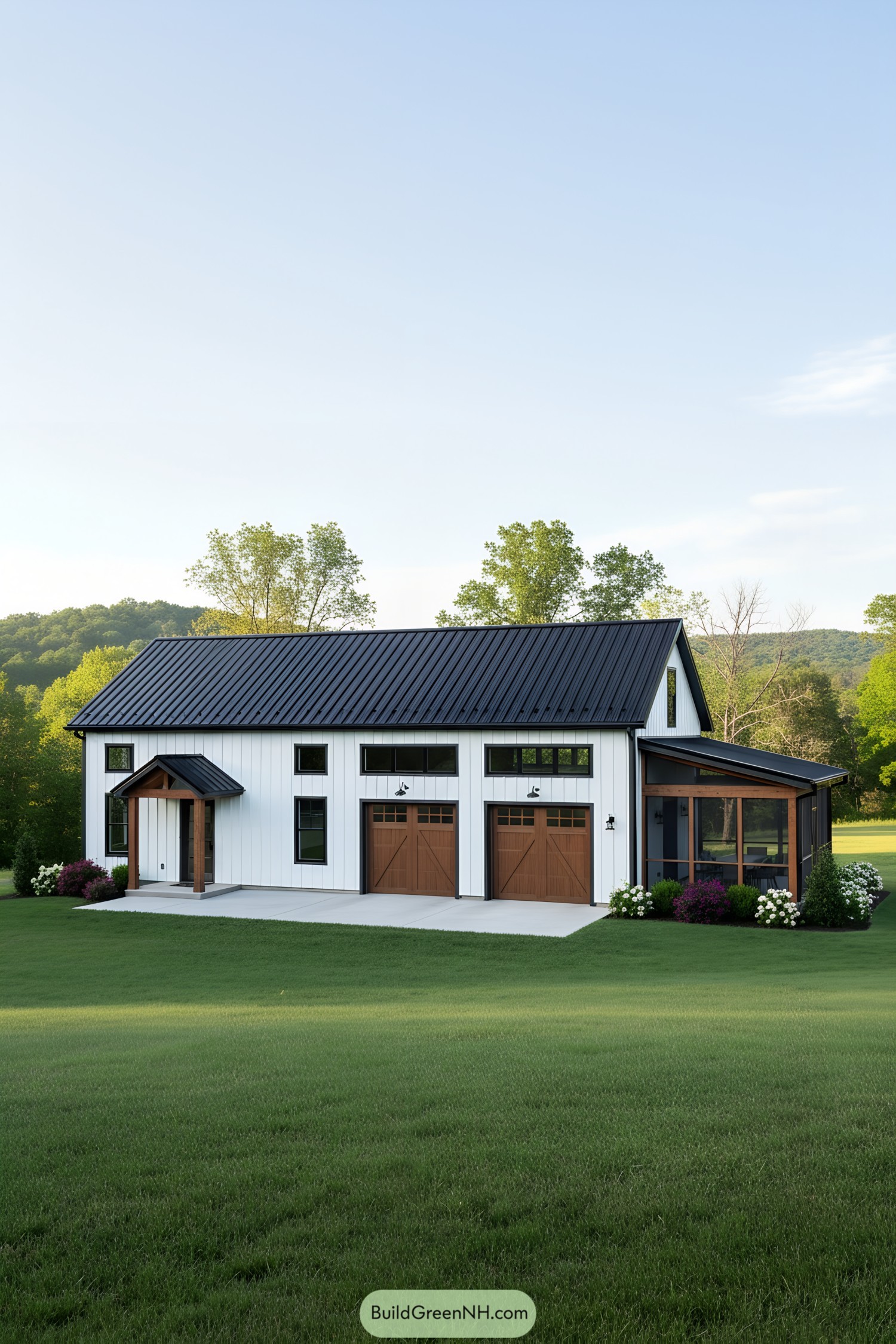 White barndominium with wood accents and porch