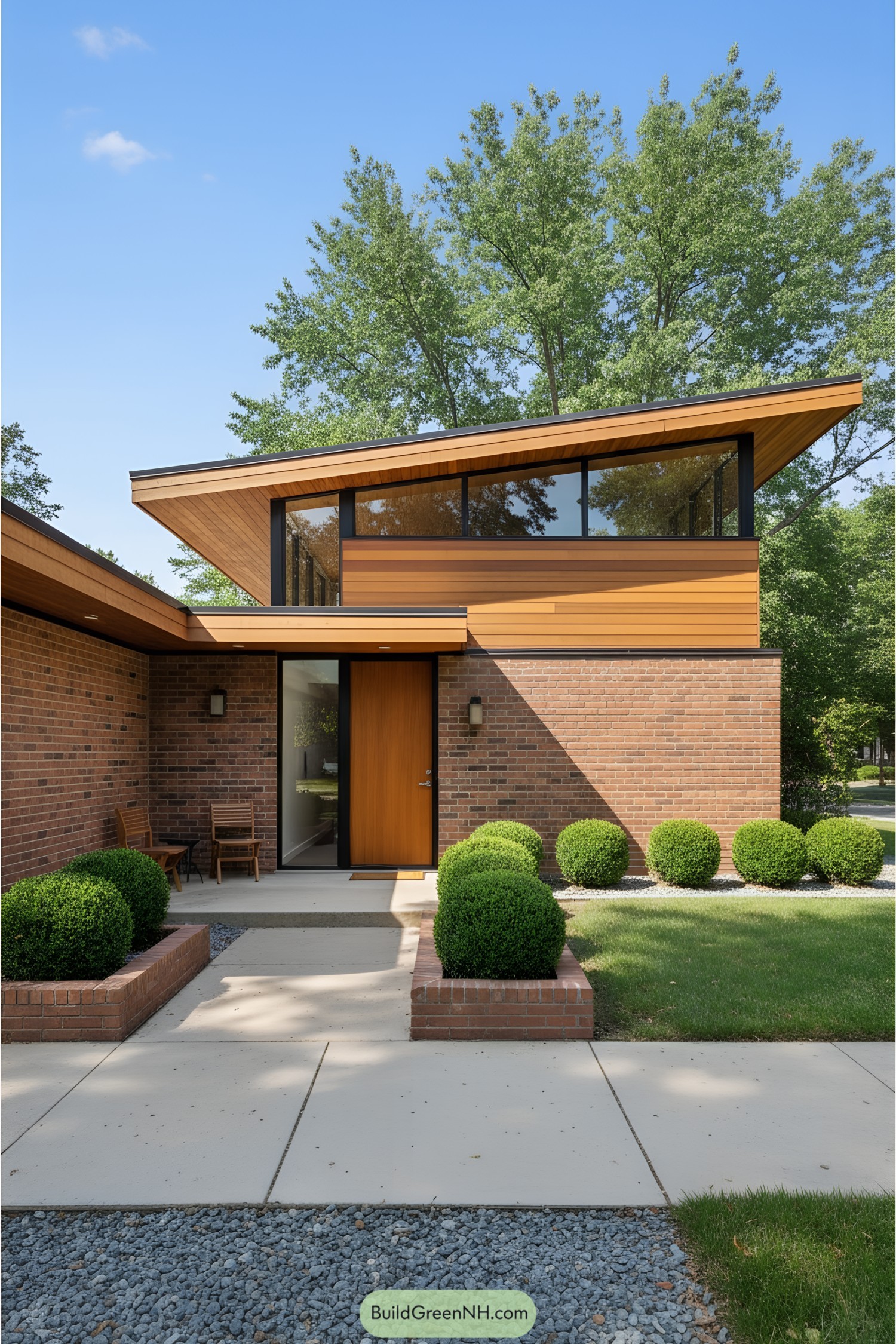 Modern townhouse with slanted roof and brick facade