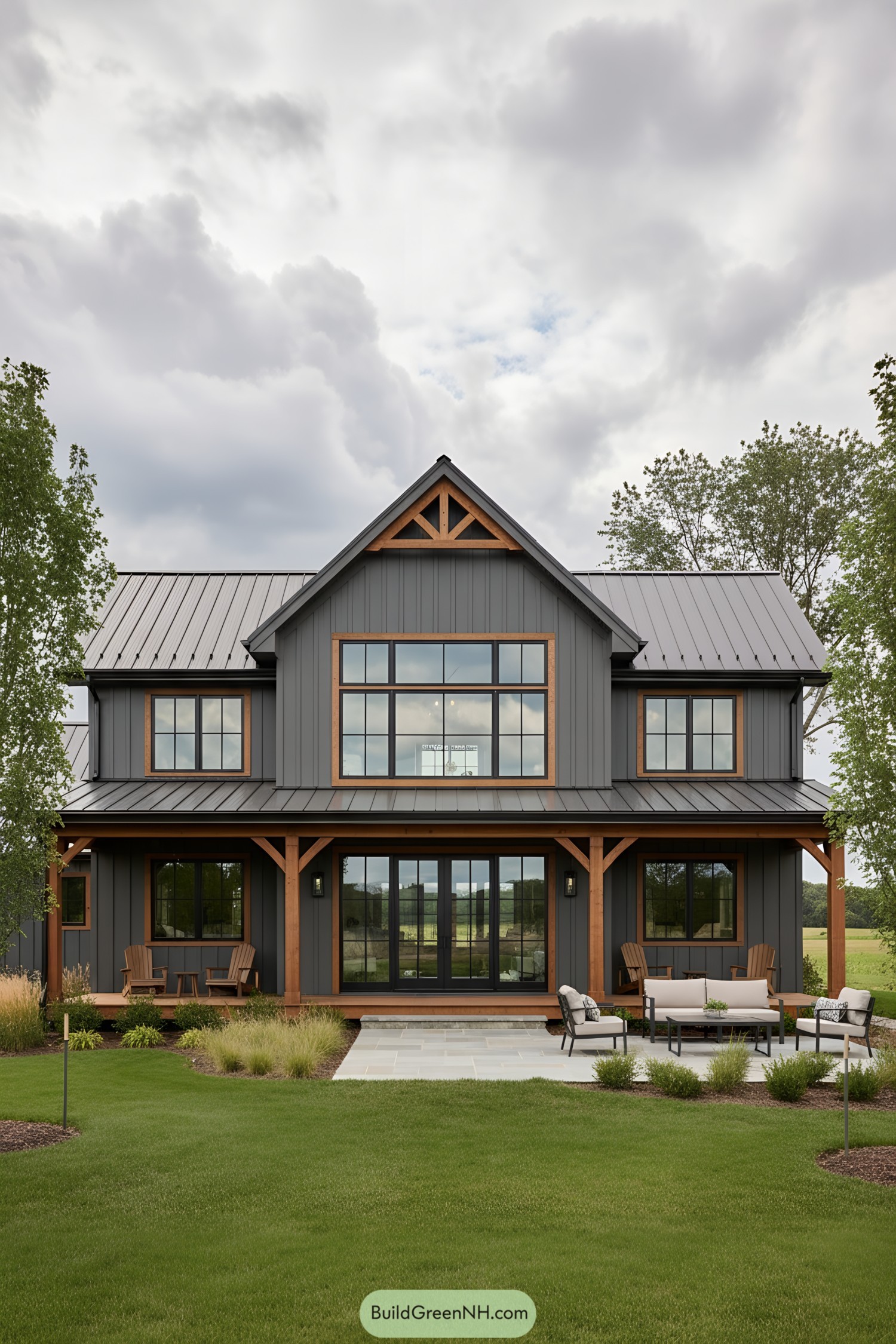Contemporary barn house with a spacious patio and lush lawn