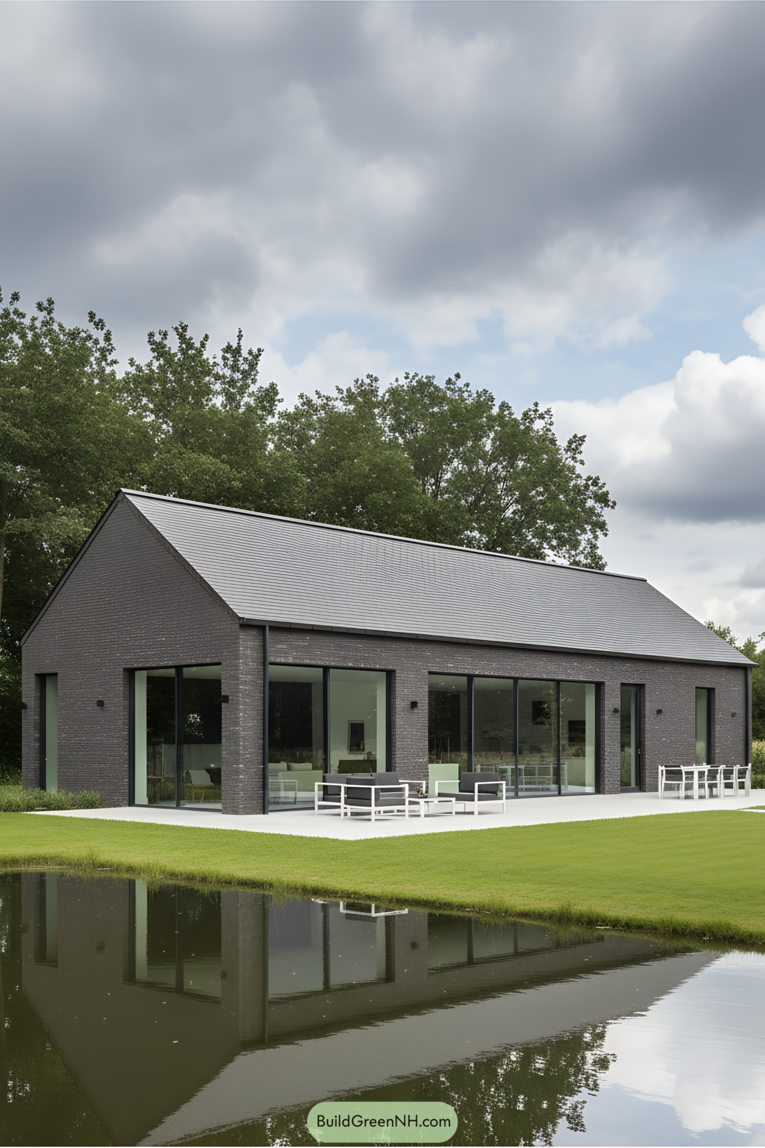 Sleek barn house with large glass windows and lush surroundings