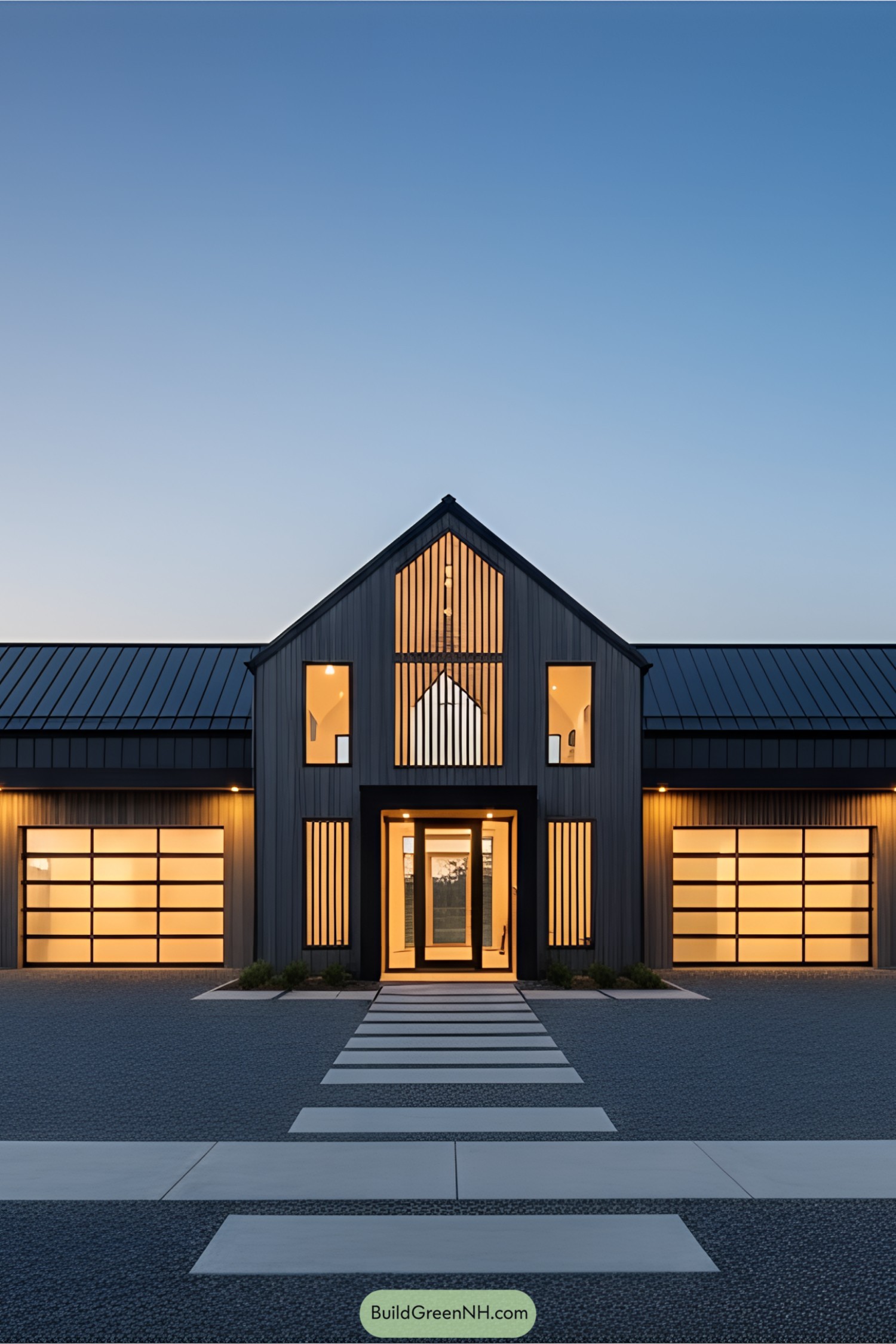 Contemporary barn house with glowing interiors at dusk