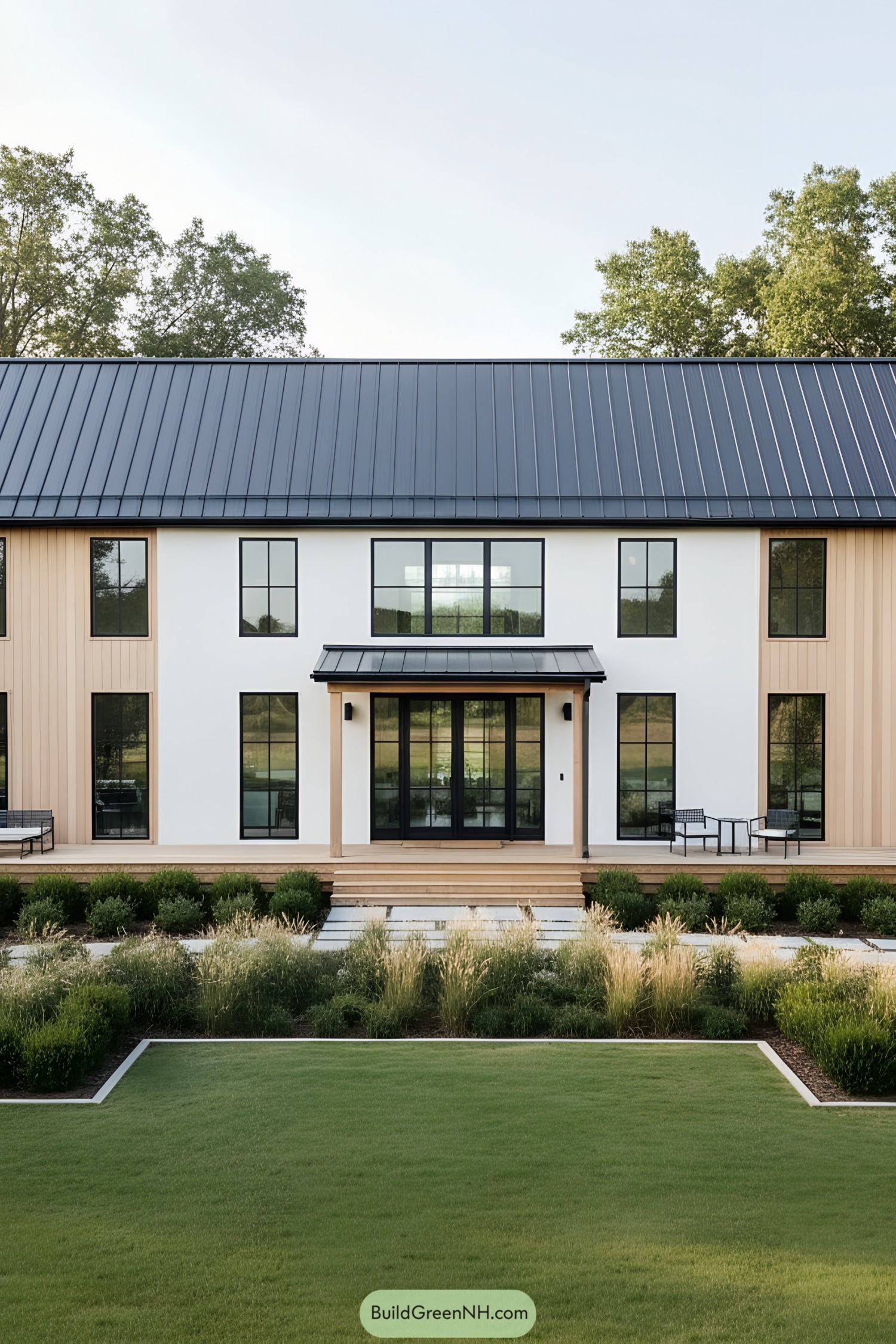Modern barn house with sleek design and surrounding foliage