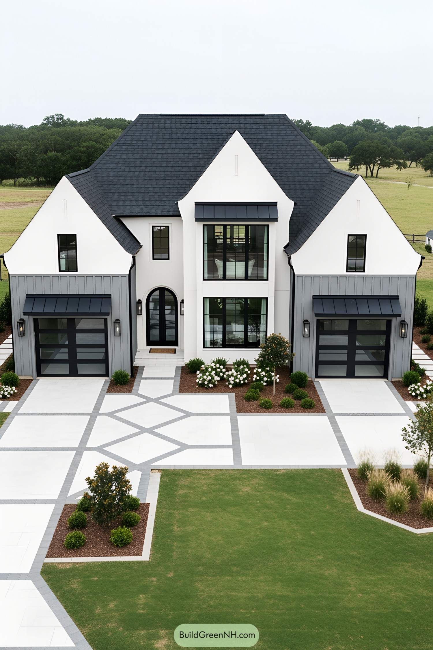 Modern cottage with white exterior, black accents, and beautiful landscaping
