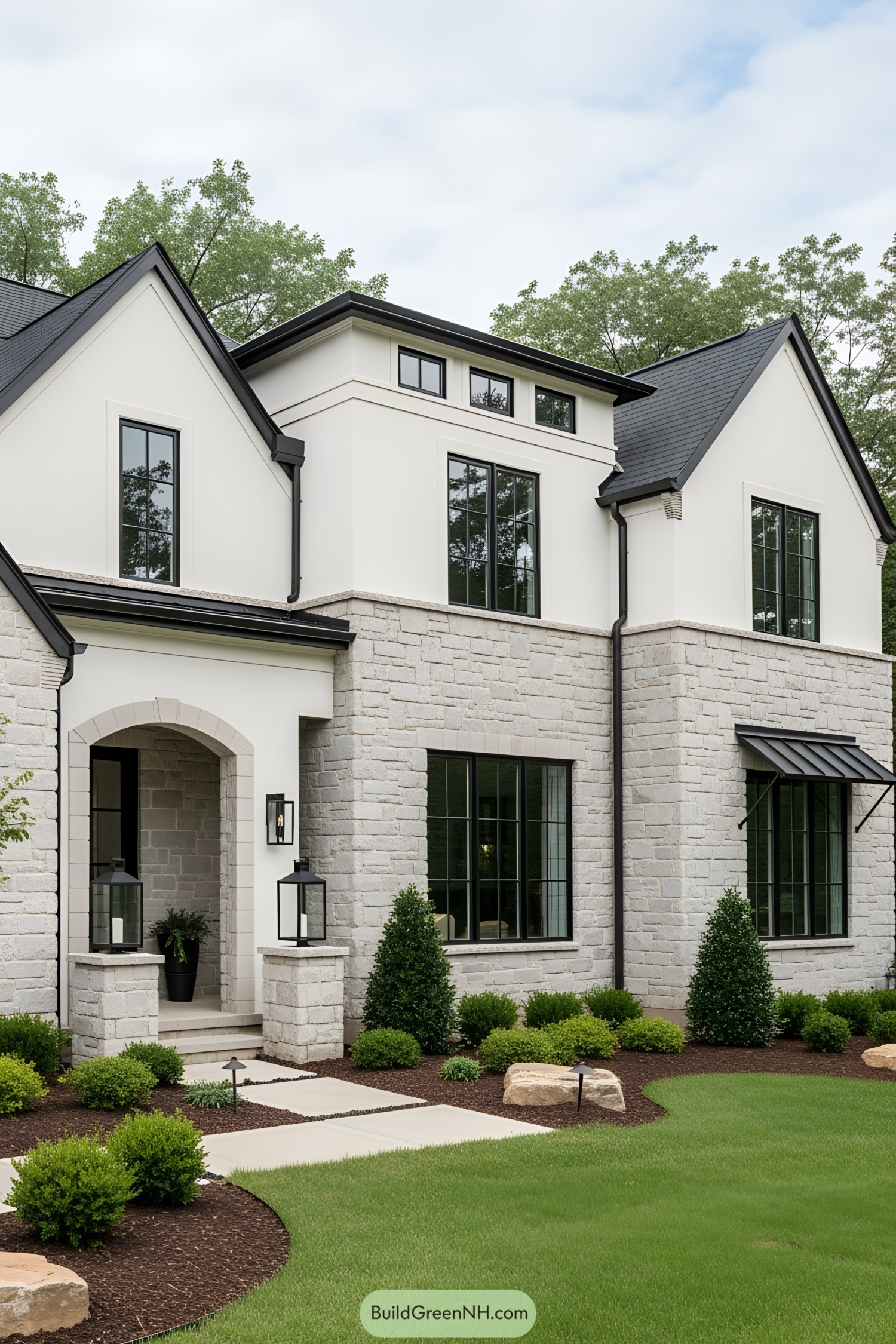 Contemporary cottage with stone facade and black accents