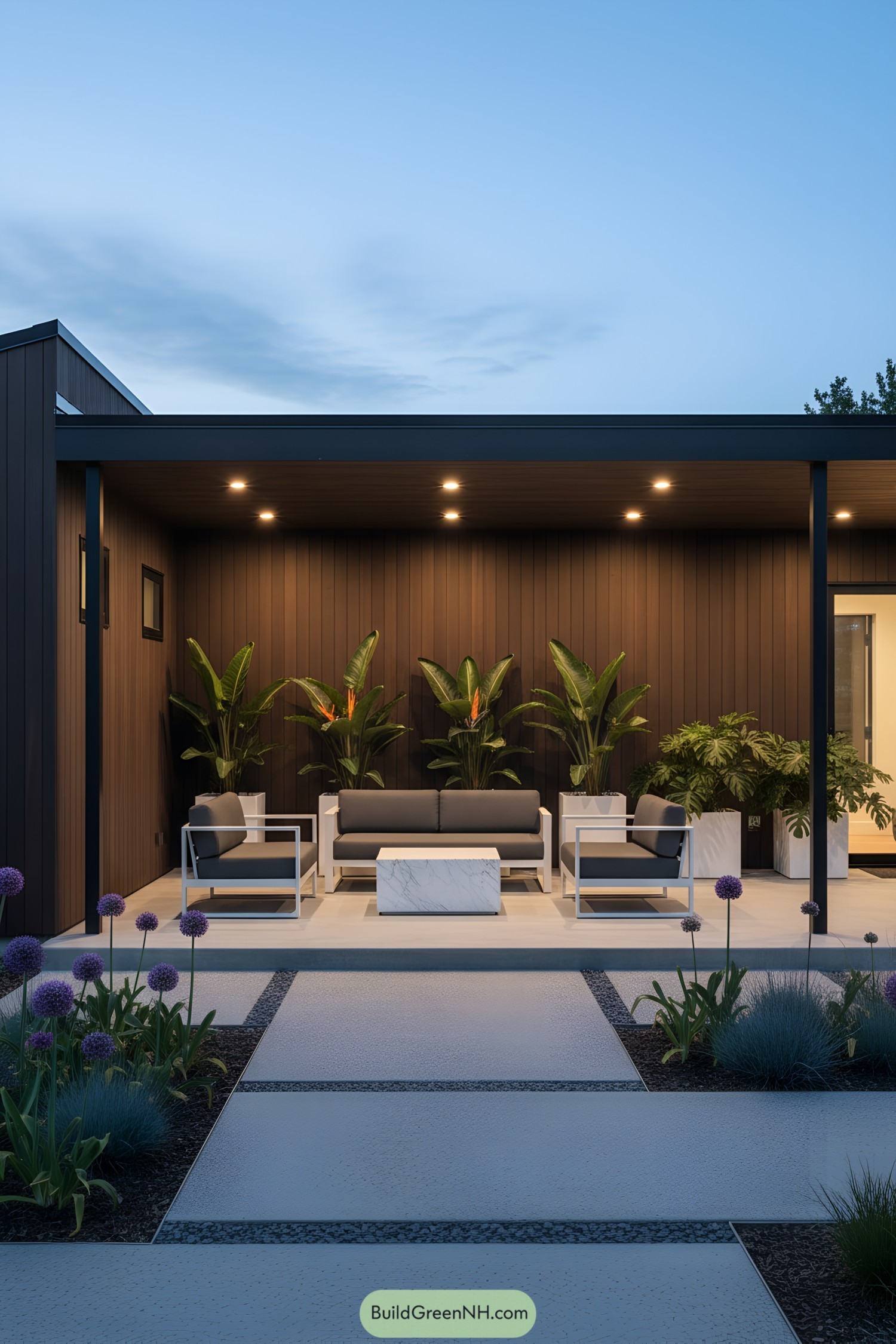 Modern house with a covered porch and lush plants