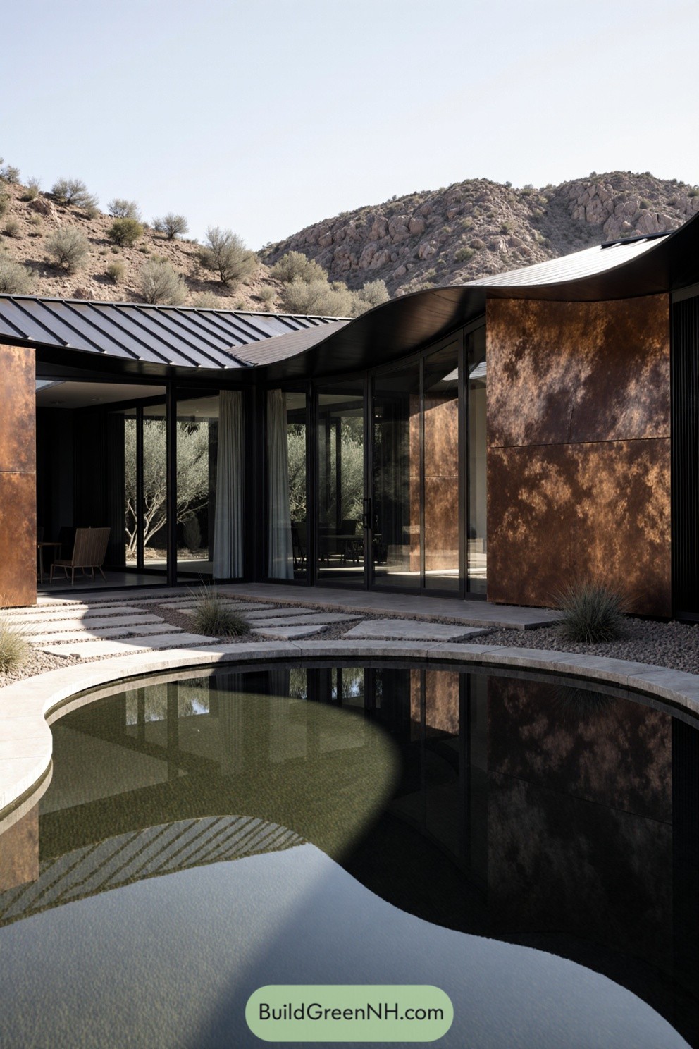 Elegant modern house with expansive glass walls and a center pond