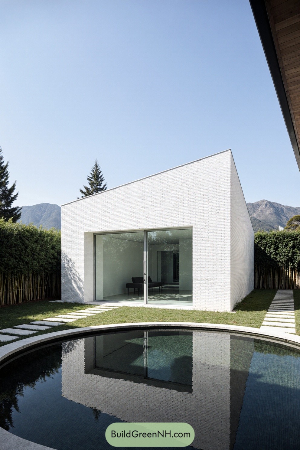 Modern house by a courtyard pond with mountain views