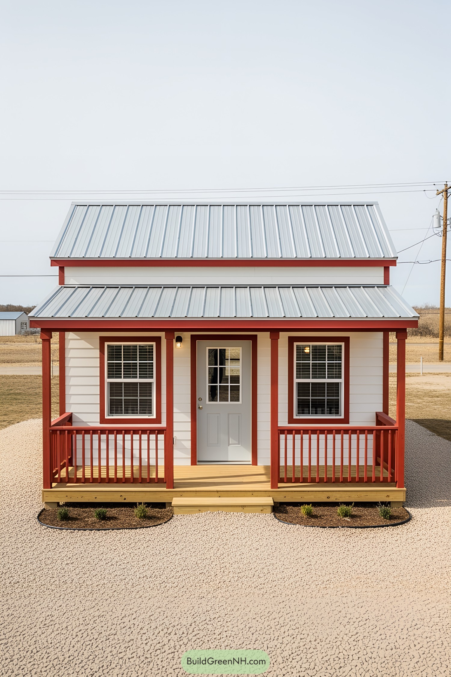 Compact cottage with metal roof and red trim