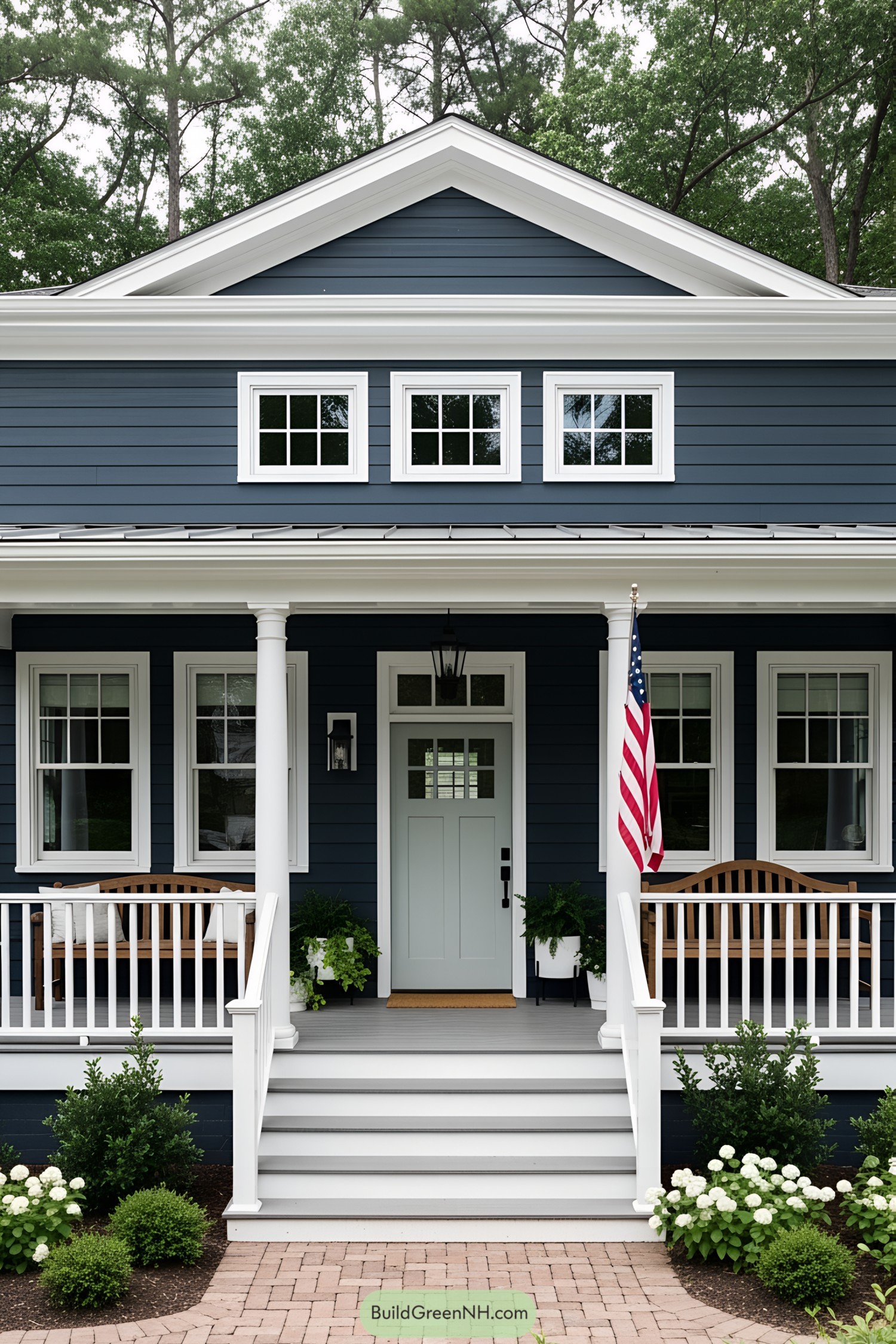 Quaint blue house with white columns and charming porch