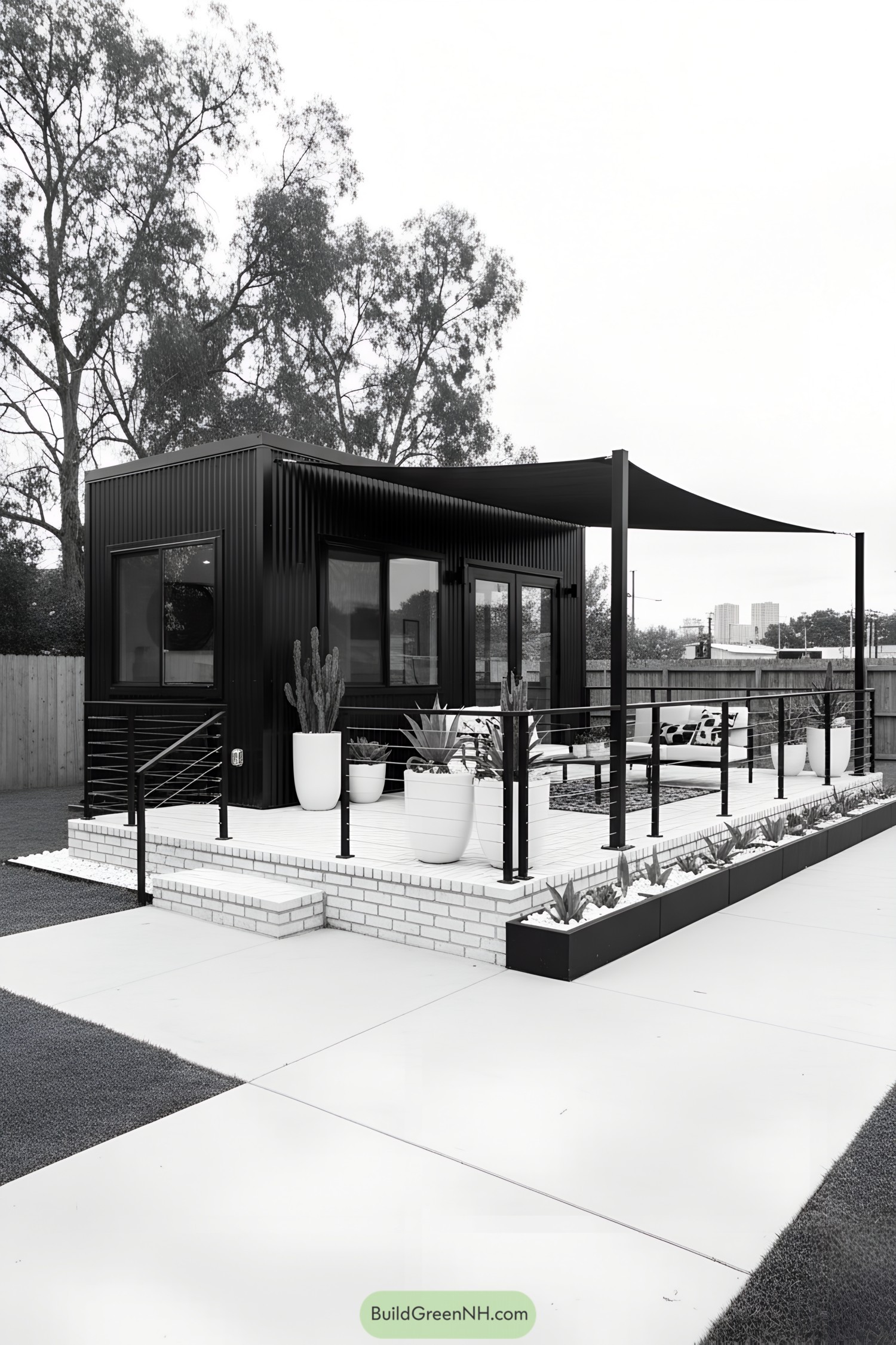 Modern tiny house with deck and shade sail