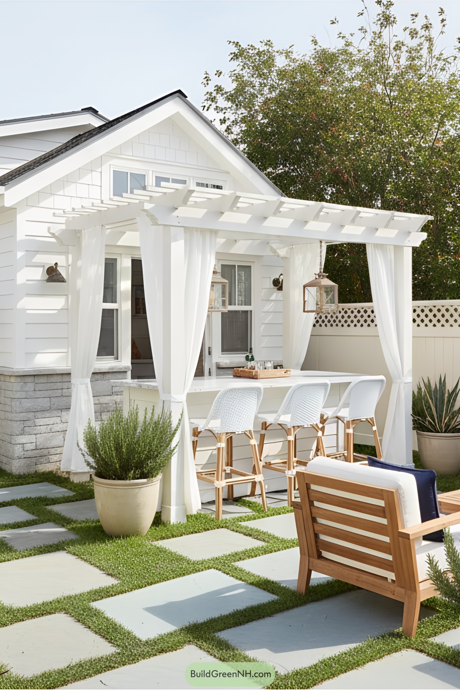 Tiny house with white pergola and outdoor seating