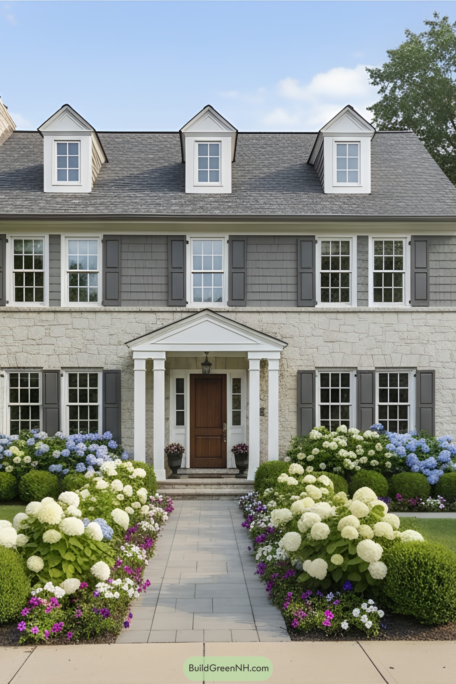 Traditional suburban home with flowers in the front yard