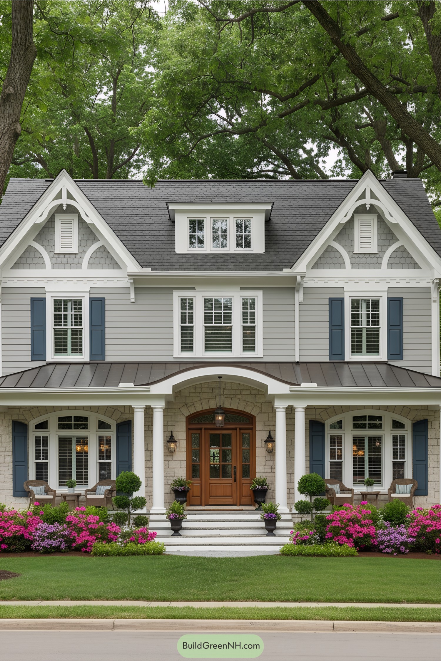 Lovely traditional house with manicured lawn and blooming flowers