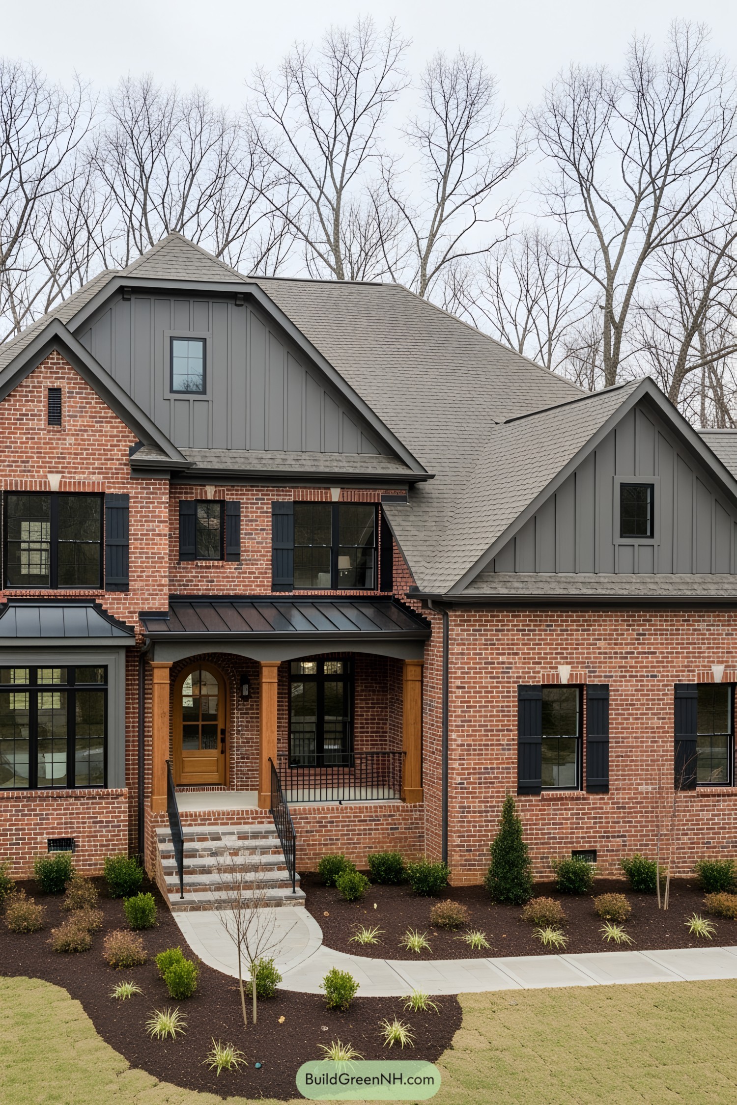 Brick house with dark shutters and a cozy porch