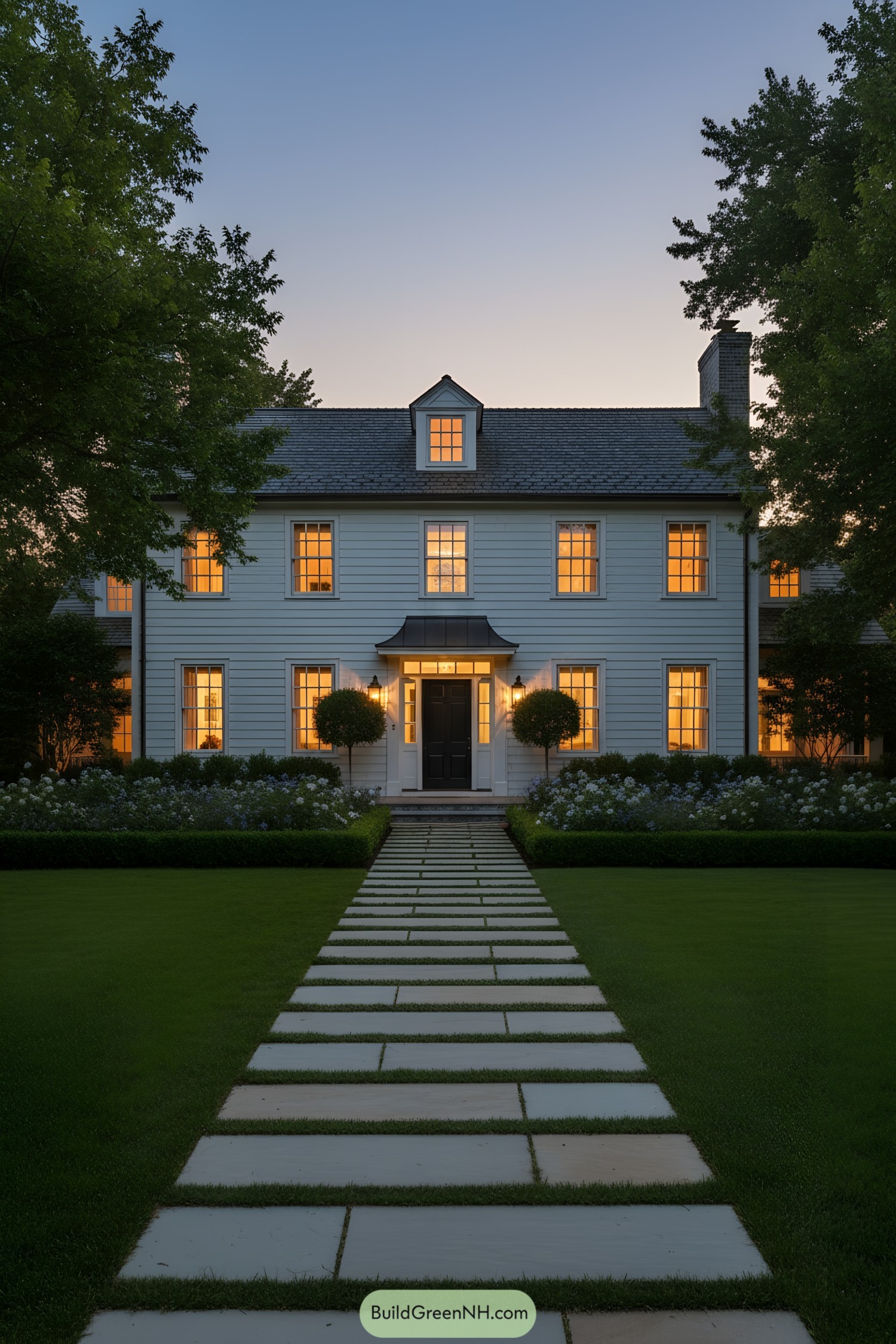 White colonial with central dormer and stone path