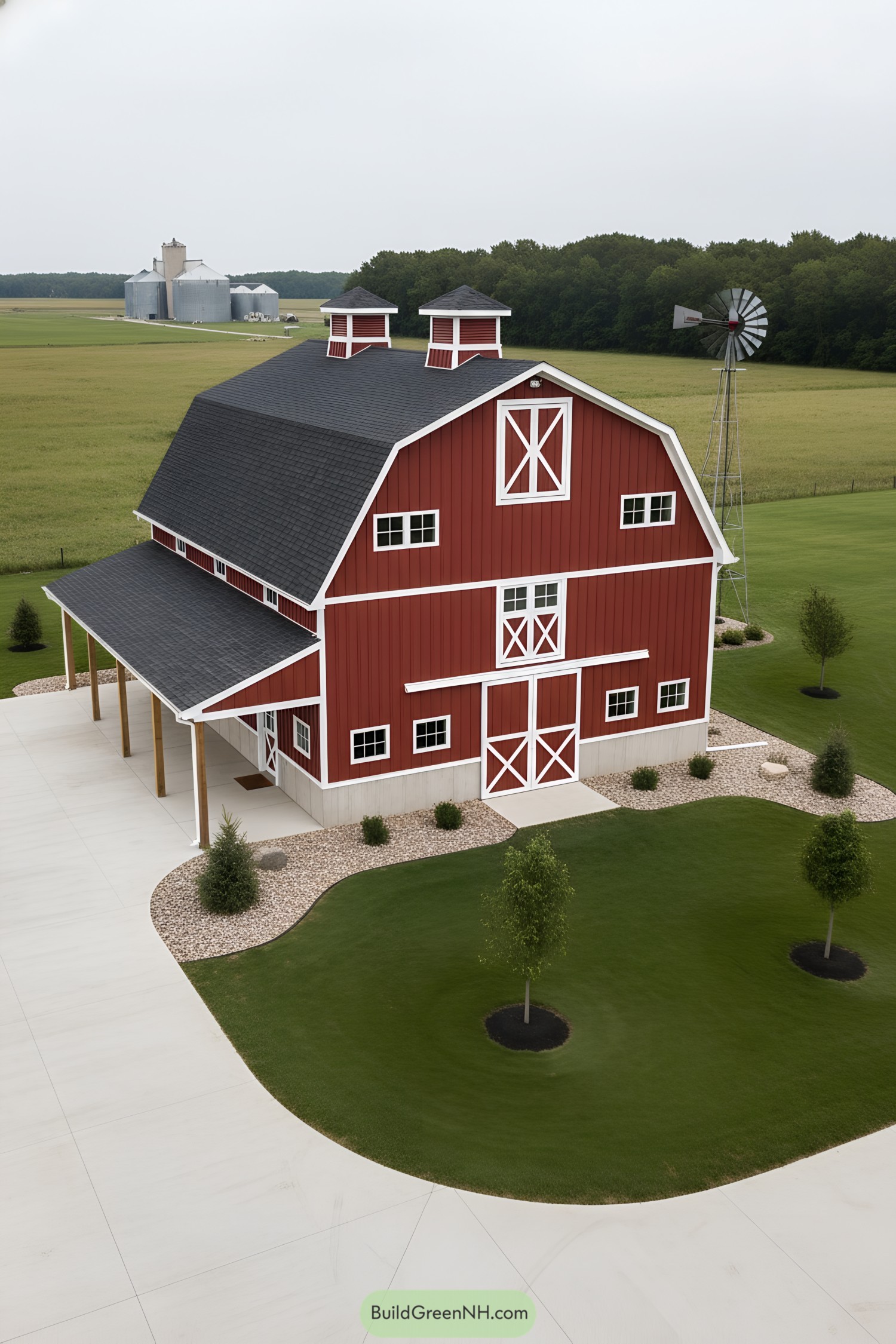 Red gambrel barn with cupolas and side porch