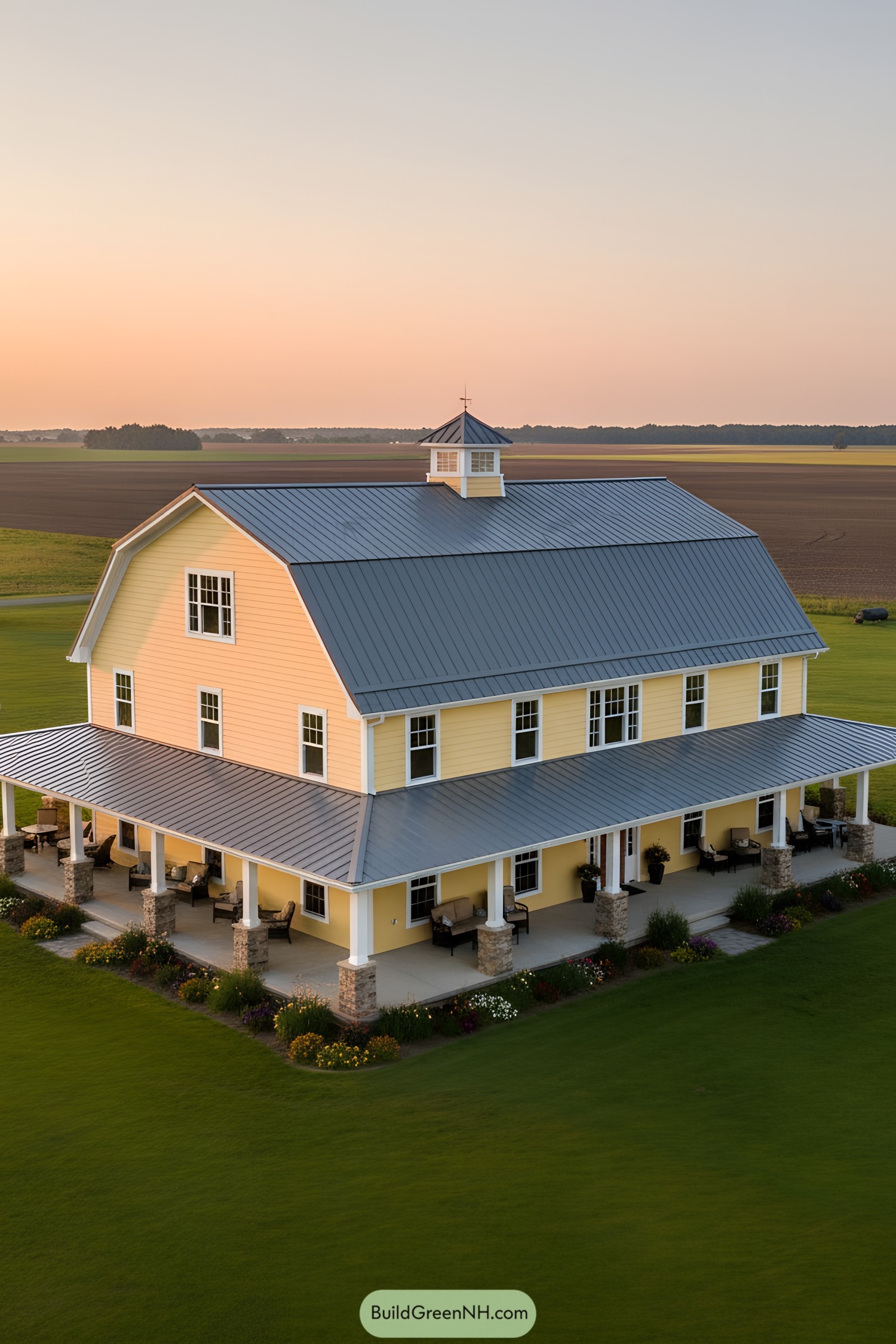 Bright yellow barn house with wraparound porch
