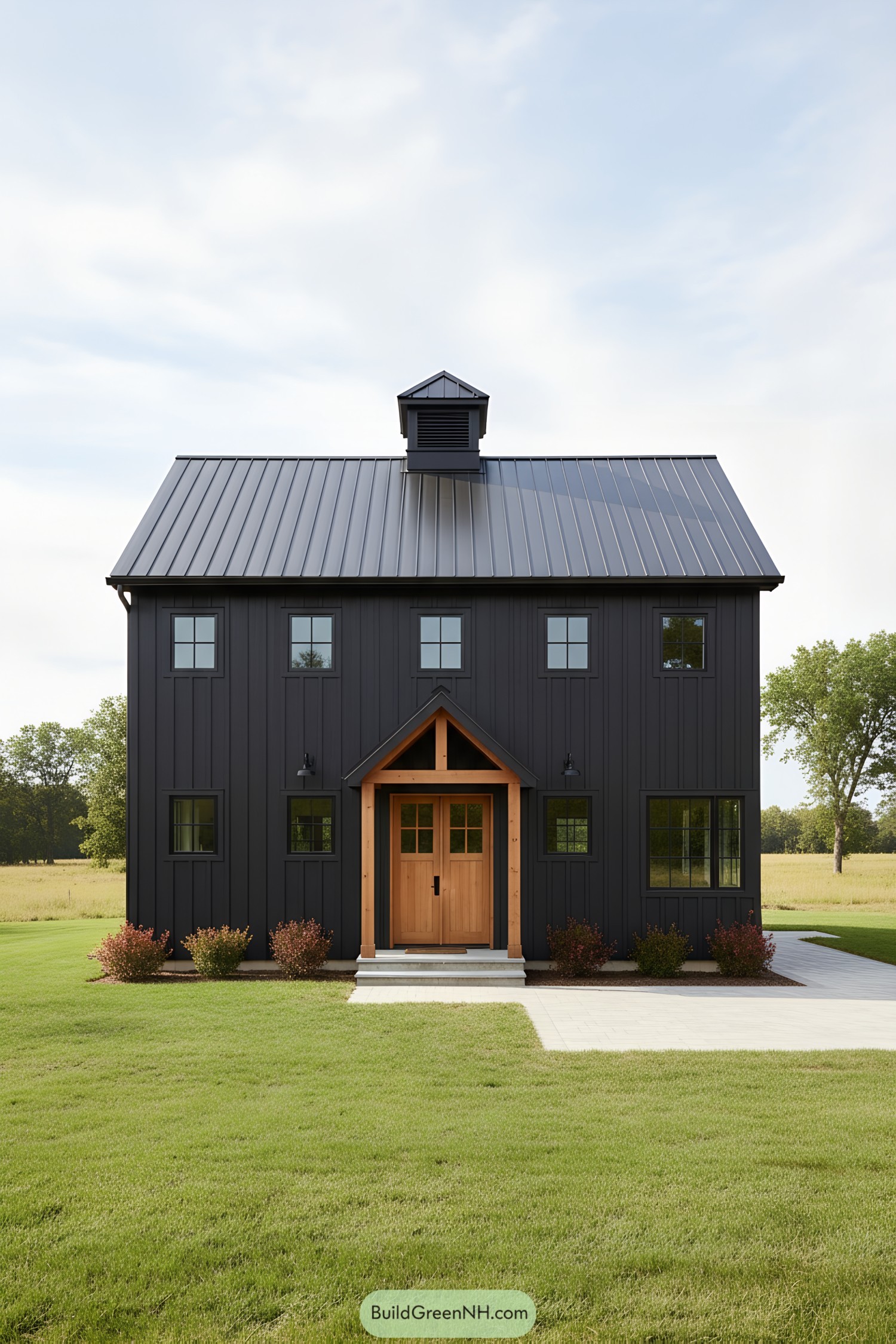 Black barn with wood entry and cupola