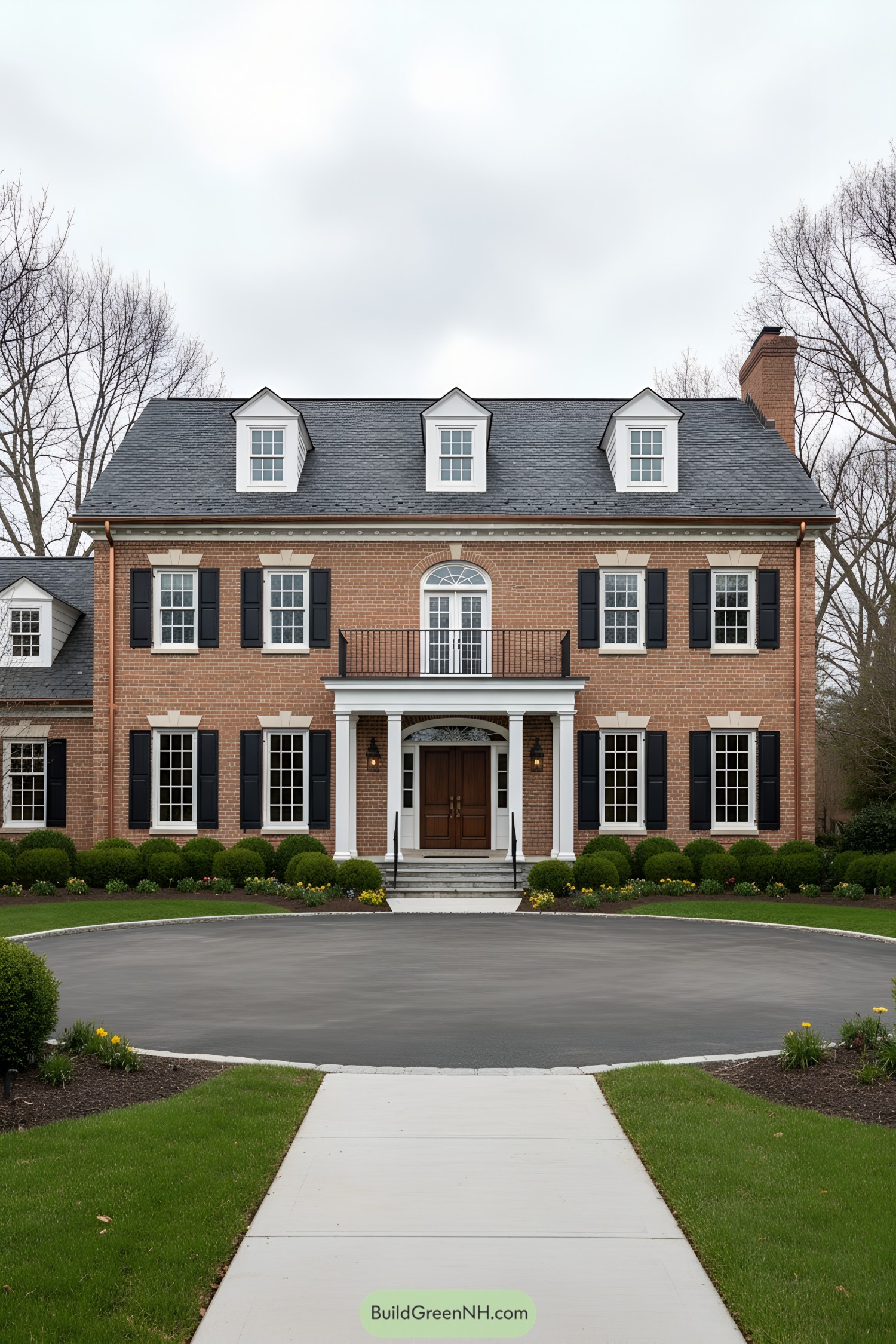 Red-brick colonial with dormers and portico