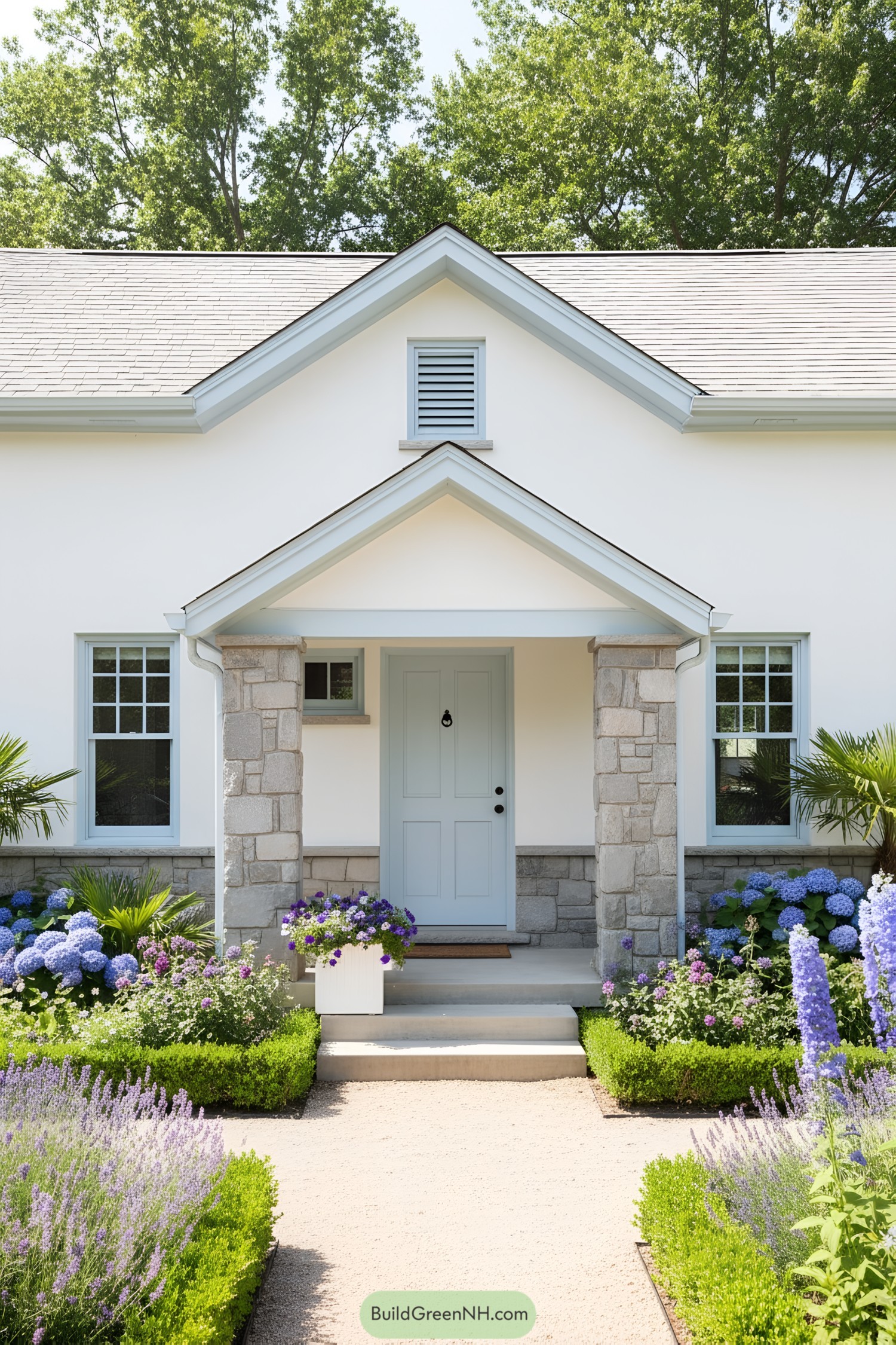 White cottage with stone porch and blue trim