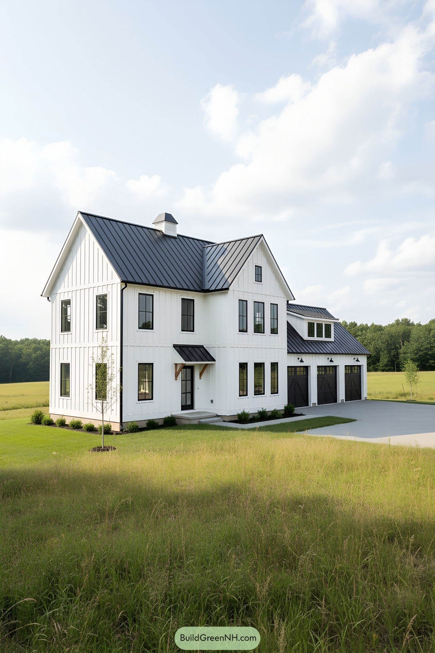 White farmhouse with black metal roof and trim