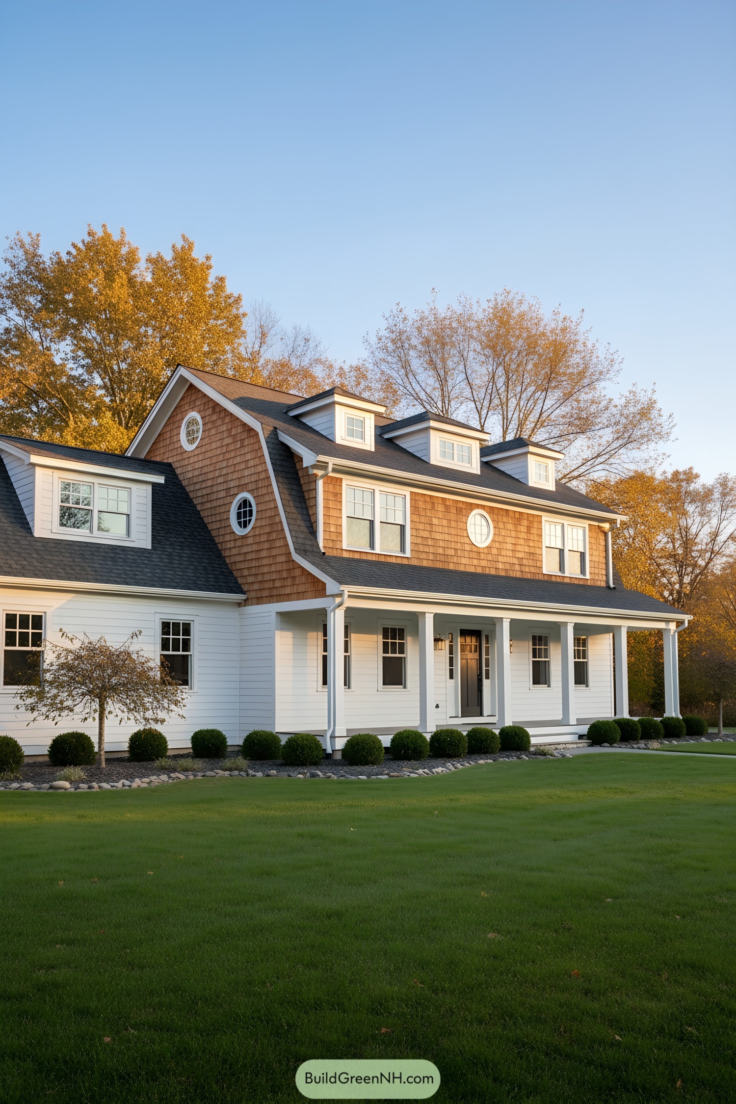 Dutch Colonial home with cedar gambrel roof, white clapboard, and dormers