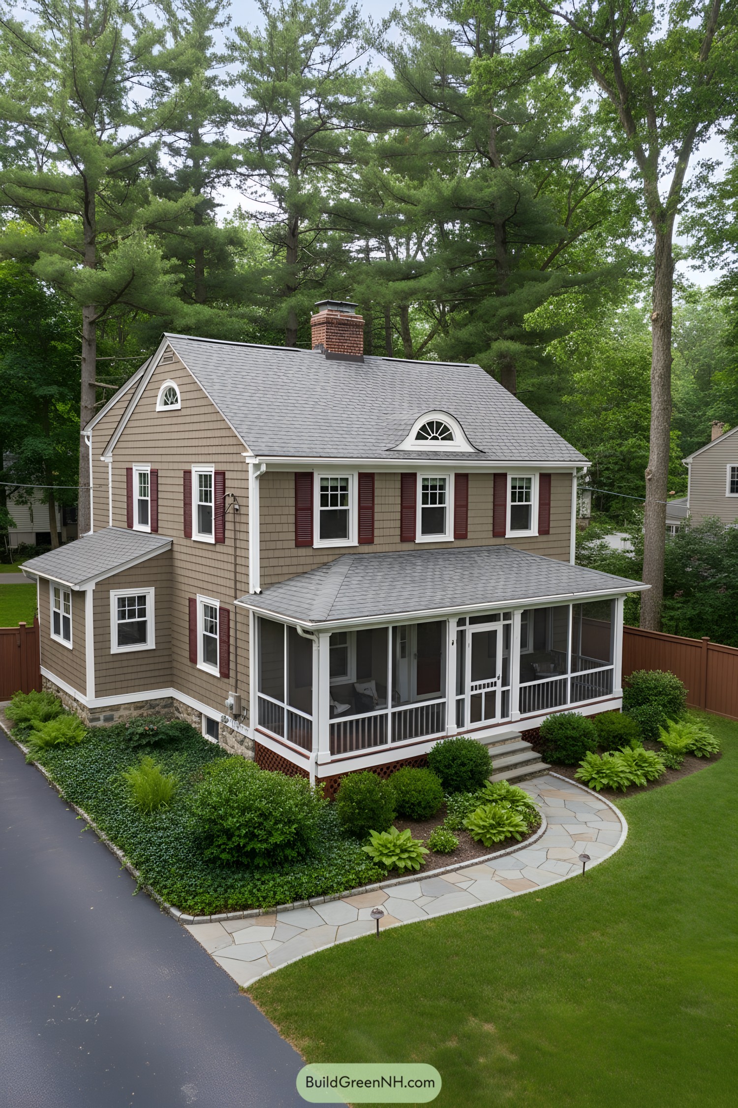 Dutch Colonial home with screened porch and eyebrow dormer