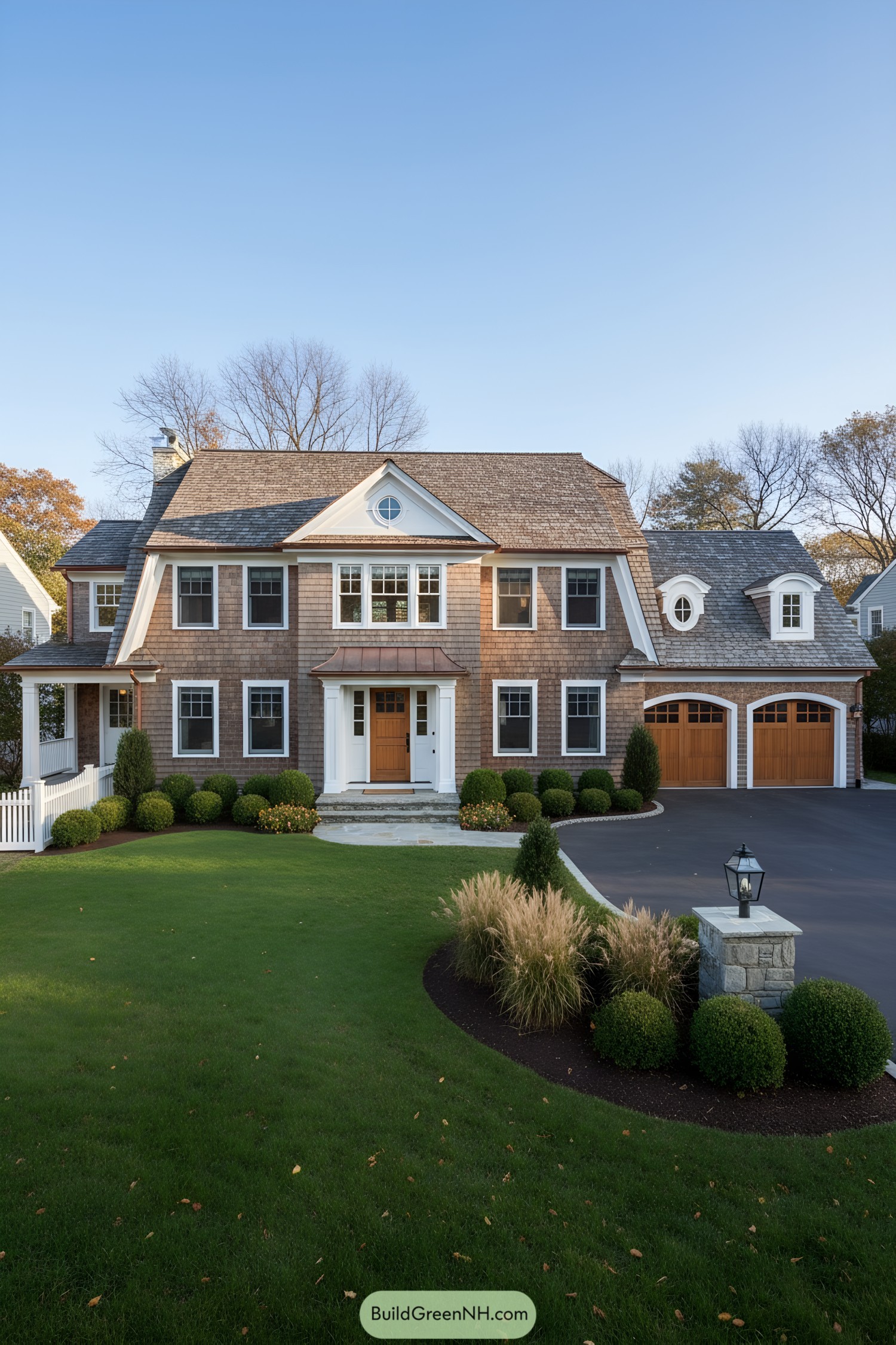 Dutch Colonial home with gambrel roof and copper awning
