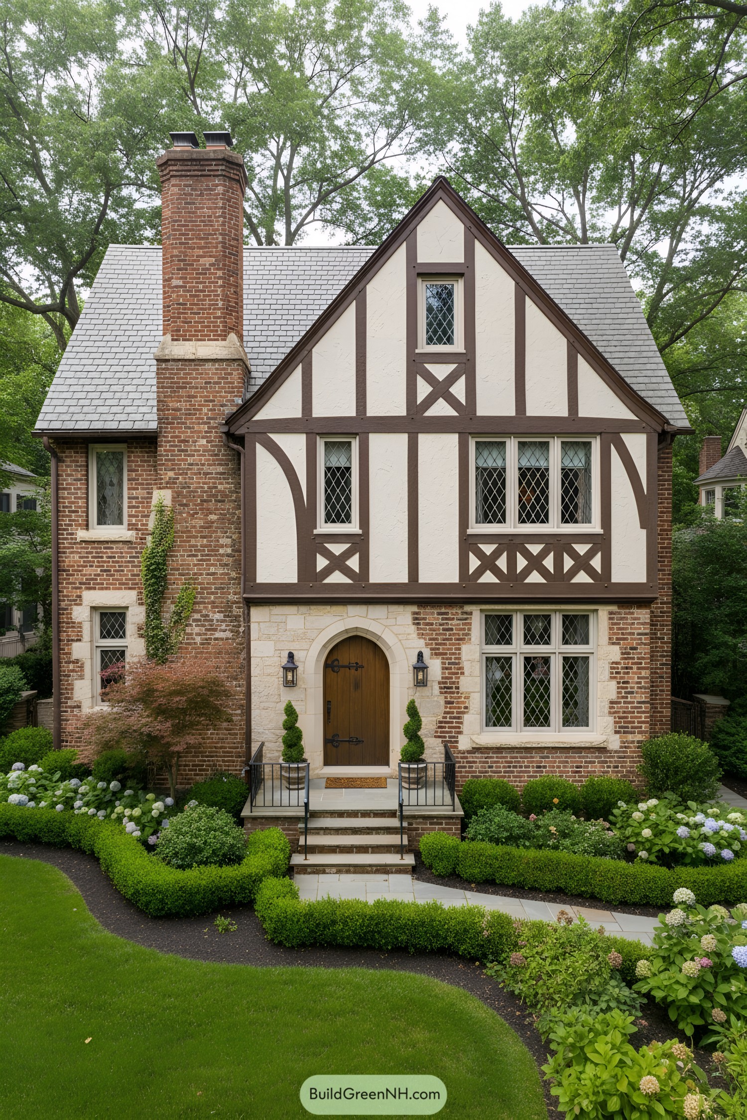 Brick-and-stucco Tudor facade with diamond windows and arched wood door