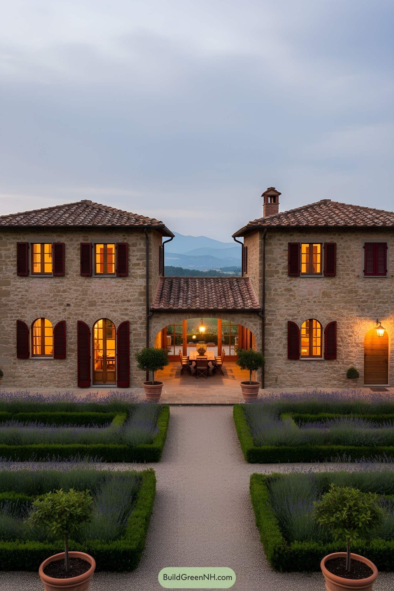 Italian stone villa with twin wings, arched loggia, red shutters, and formal lavender parterres at dusk