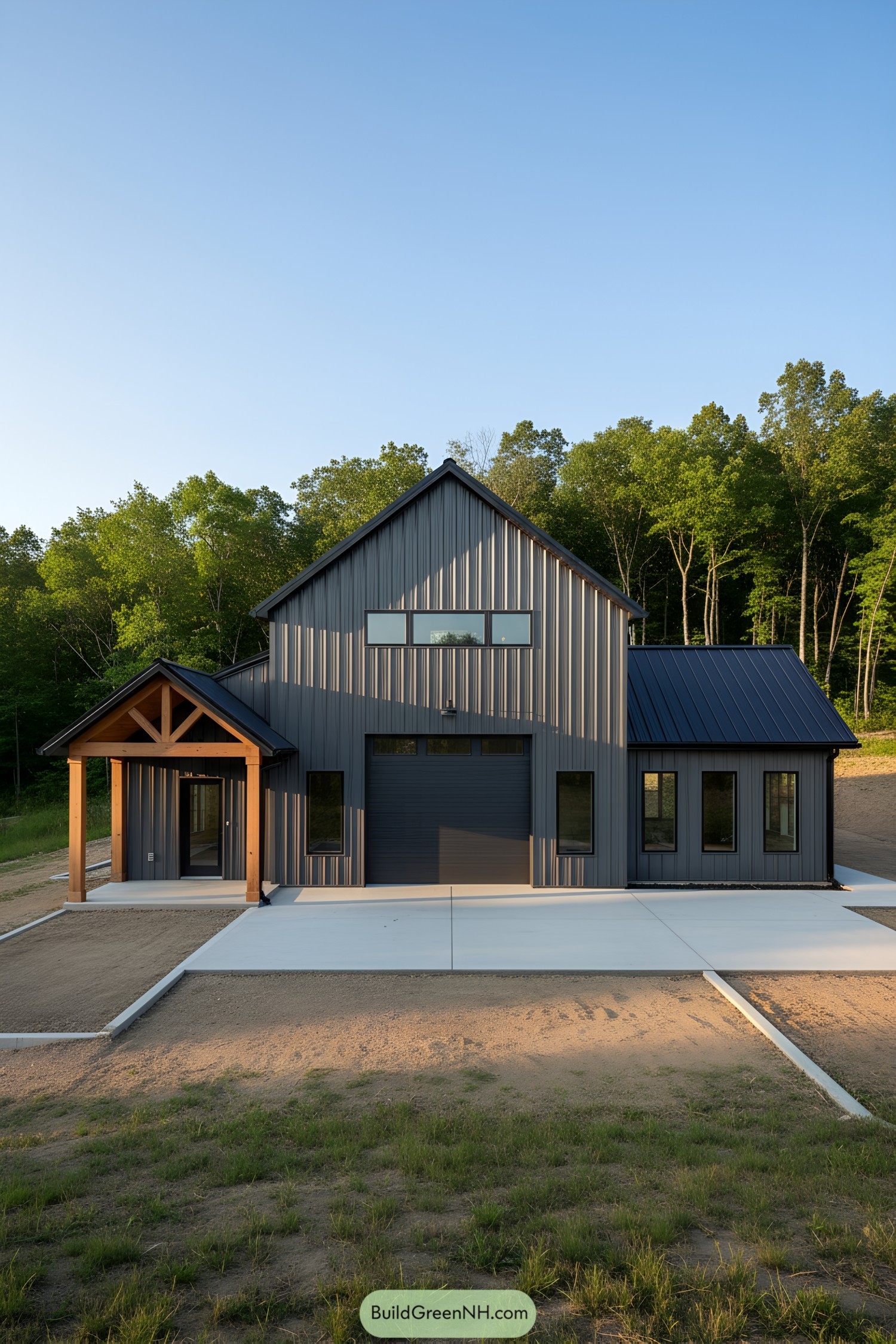 Dark metal barndominium with timber porch and central garage door