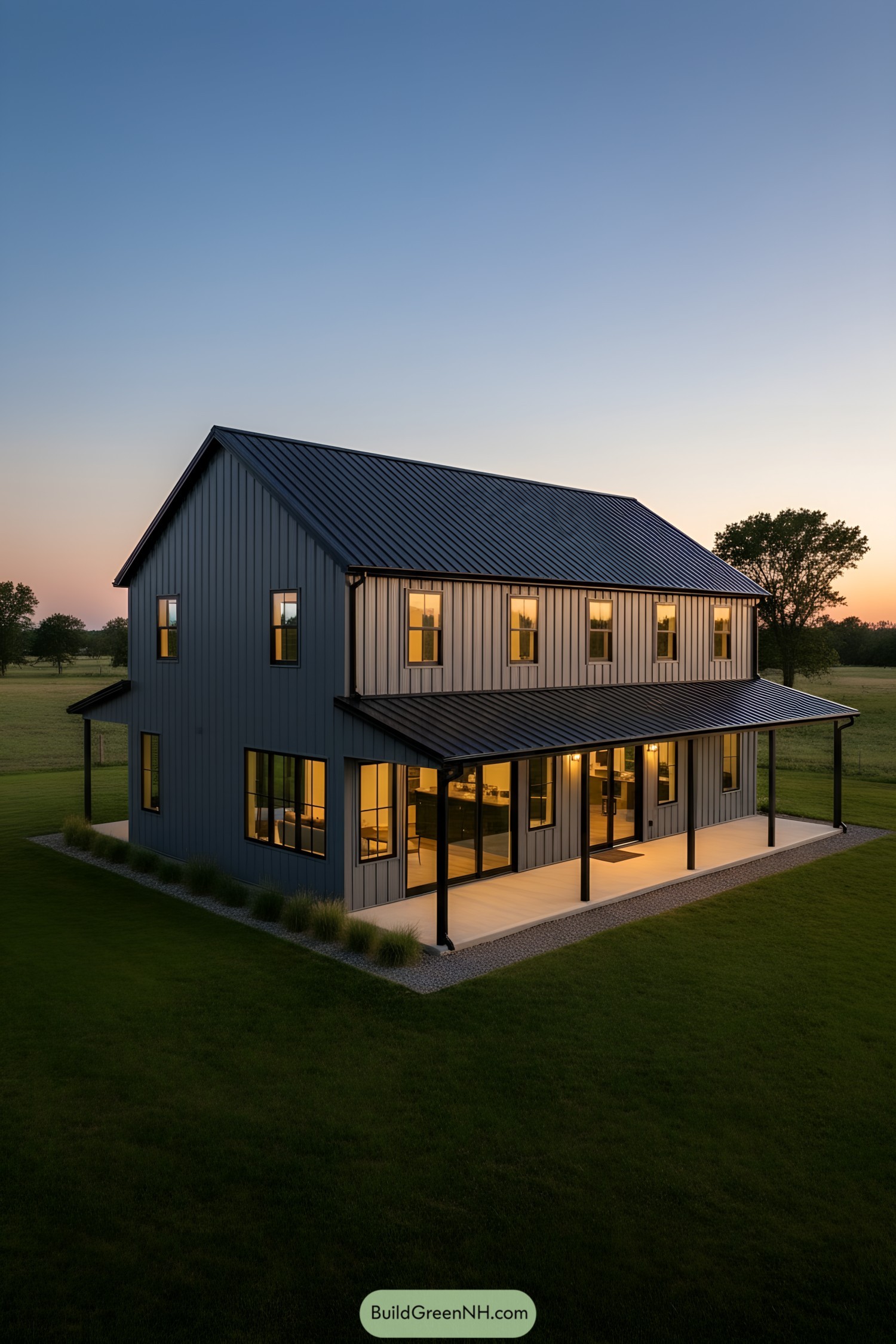 Two-story gray metal barn home at dusk