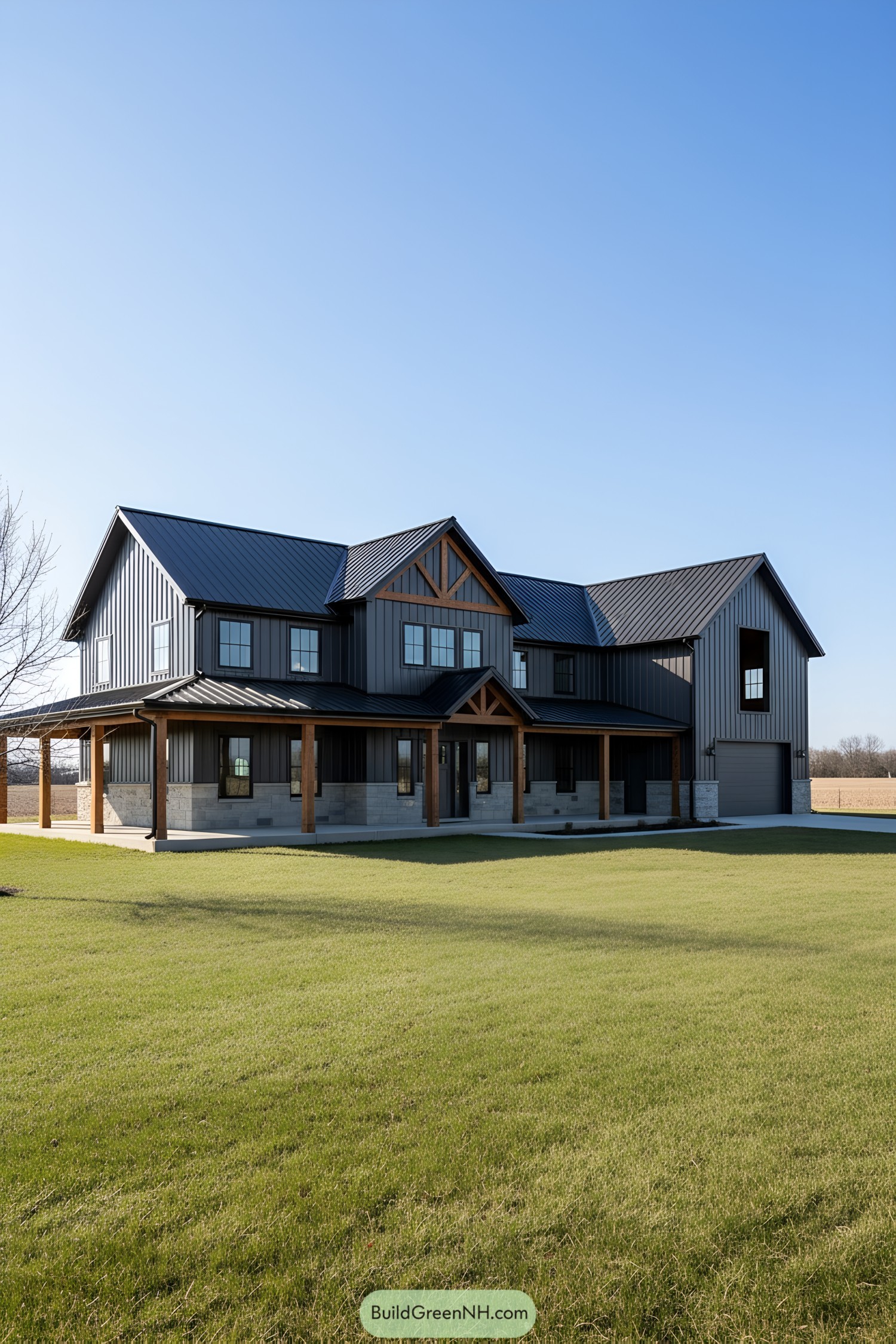 Two-story metal barn home with dark vertical siding, timber posts, and wraparound porch