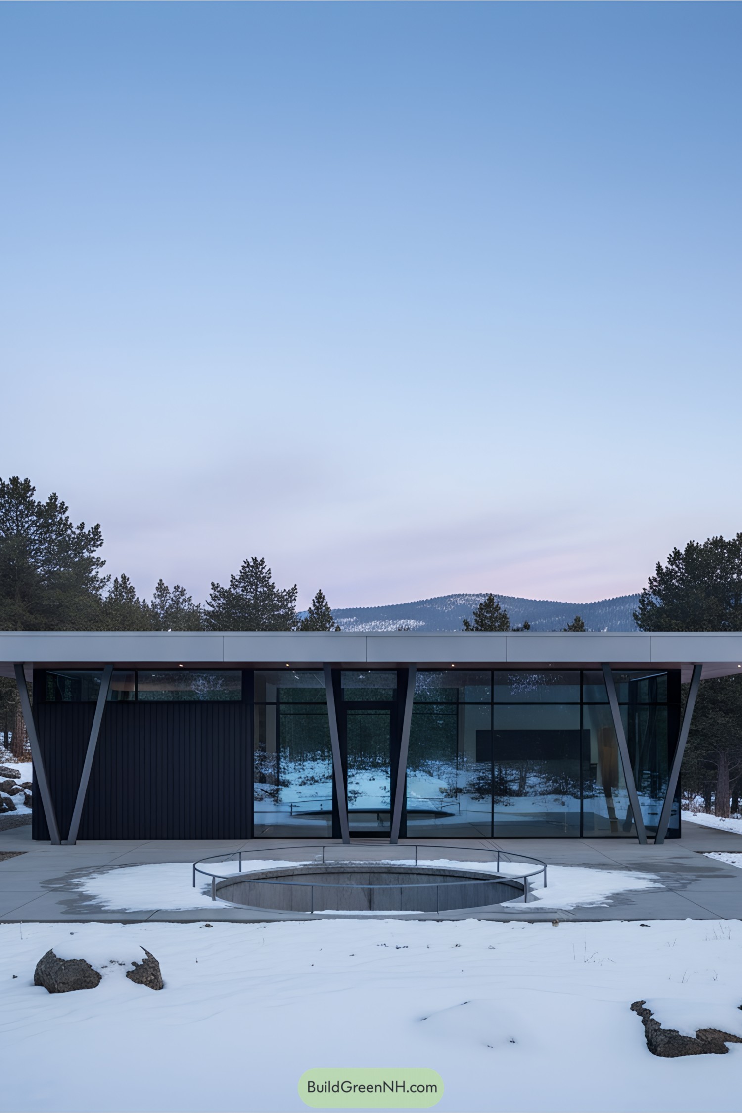 Modern house with glass façade surrounded by snow