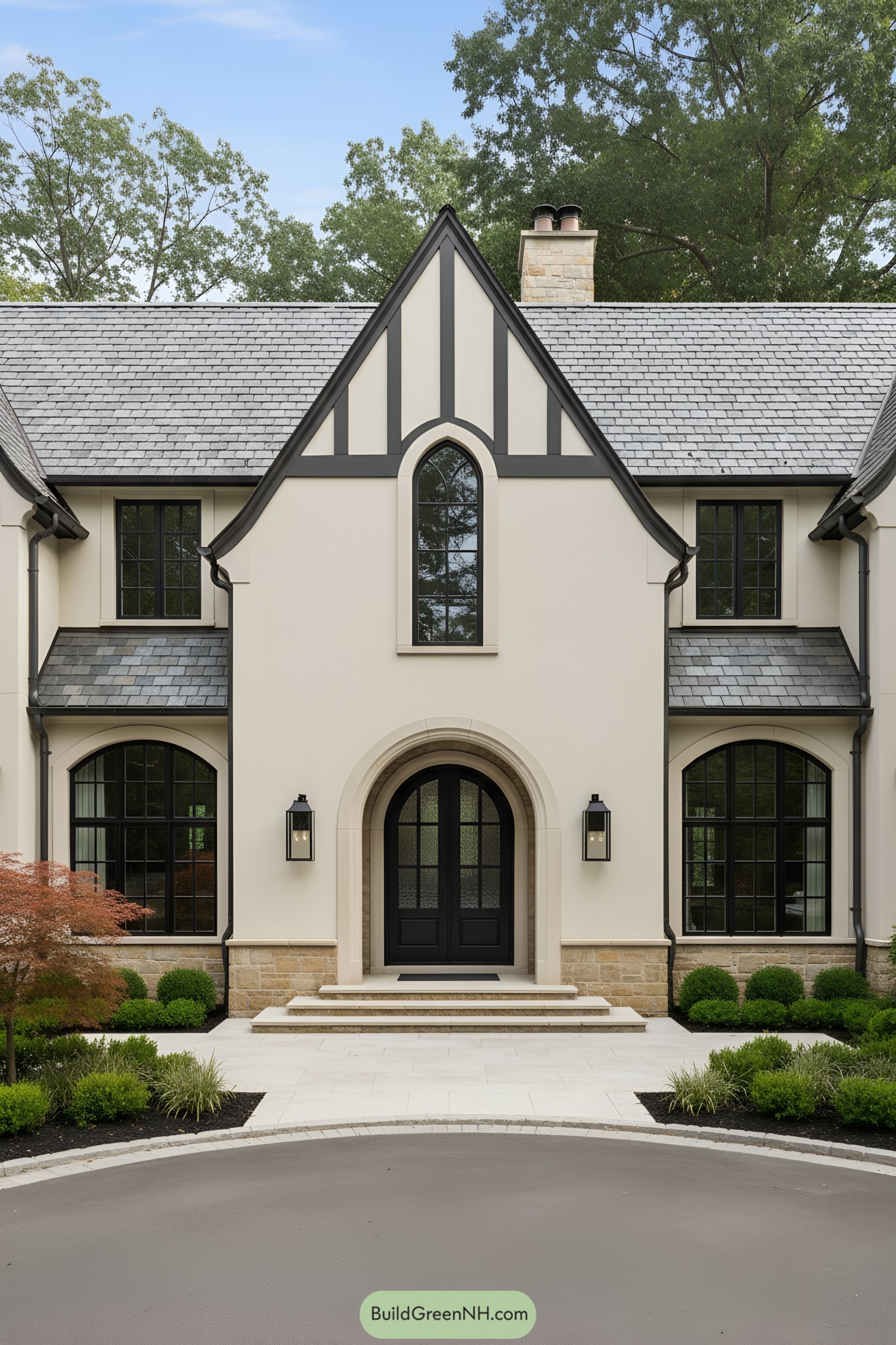 Cream stucco Tudor facade with arched entry