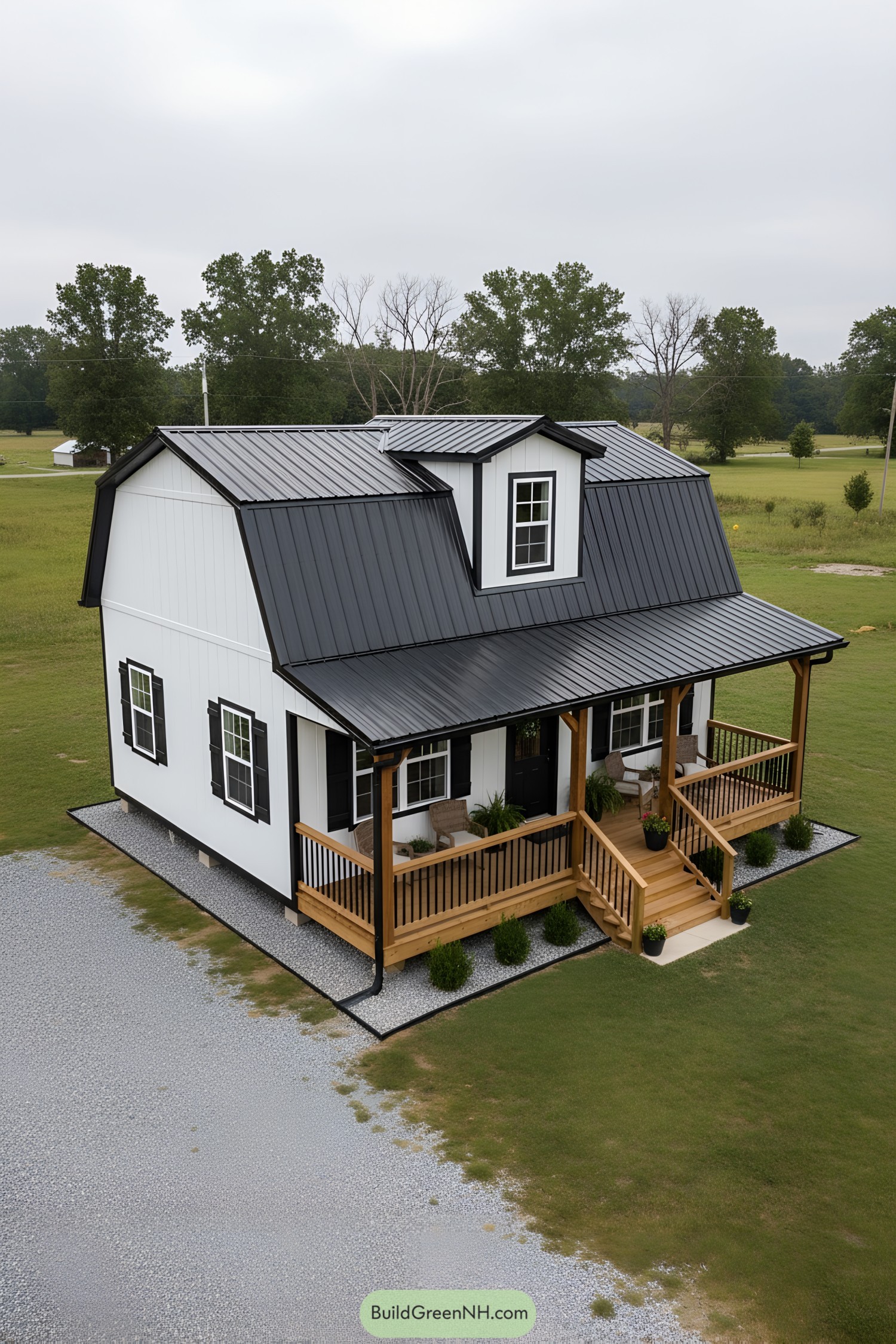 Black metal-roof gambrel cottage with wood porch