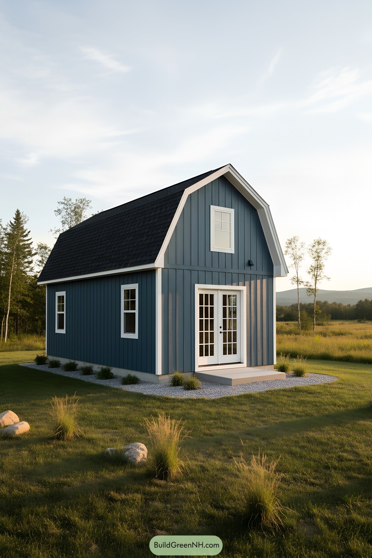 Blue gambrel shed with white trim and French doors