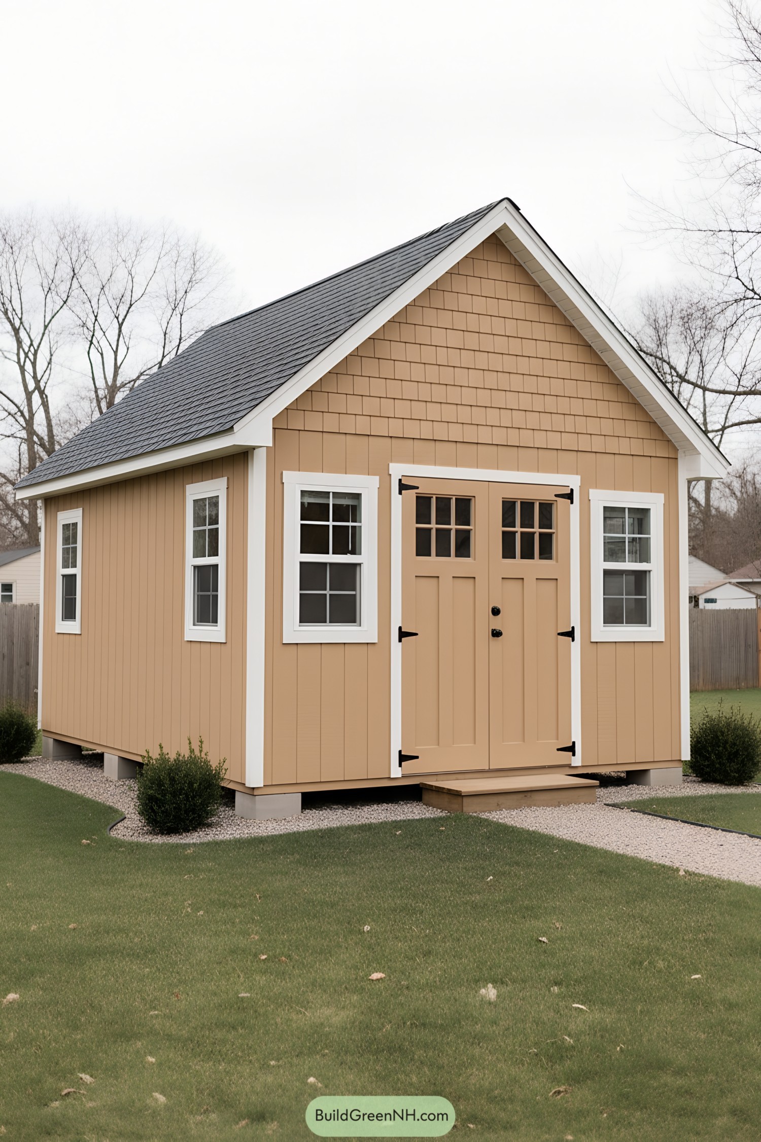 Tan gable shed with double doors and white trim