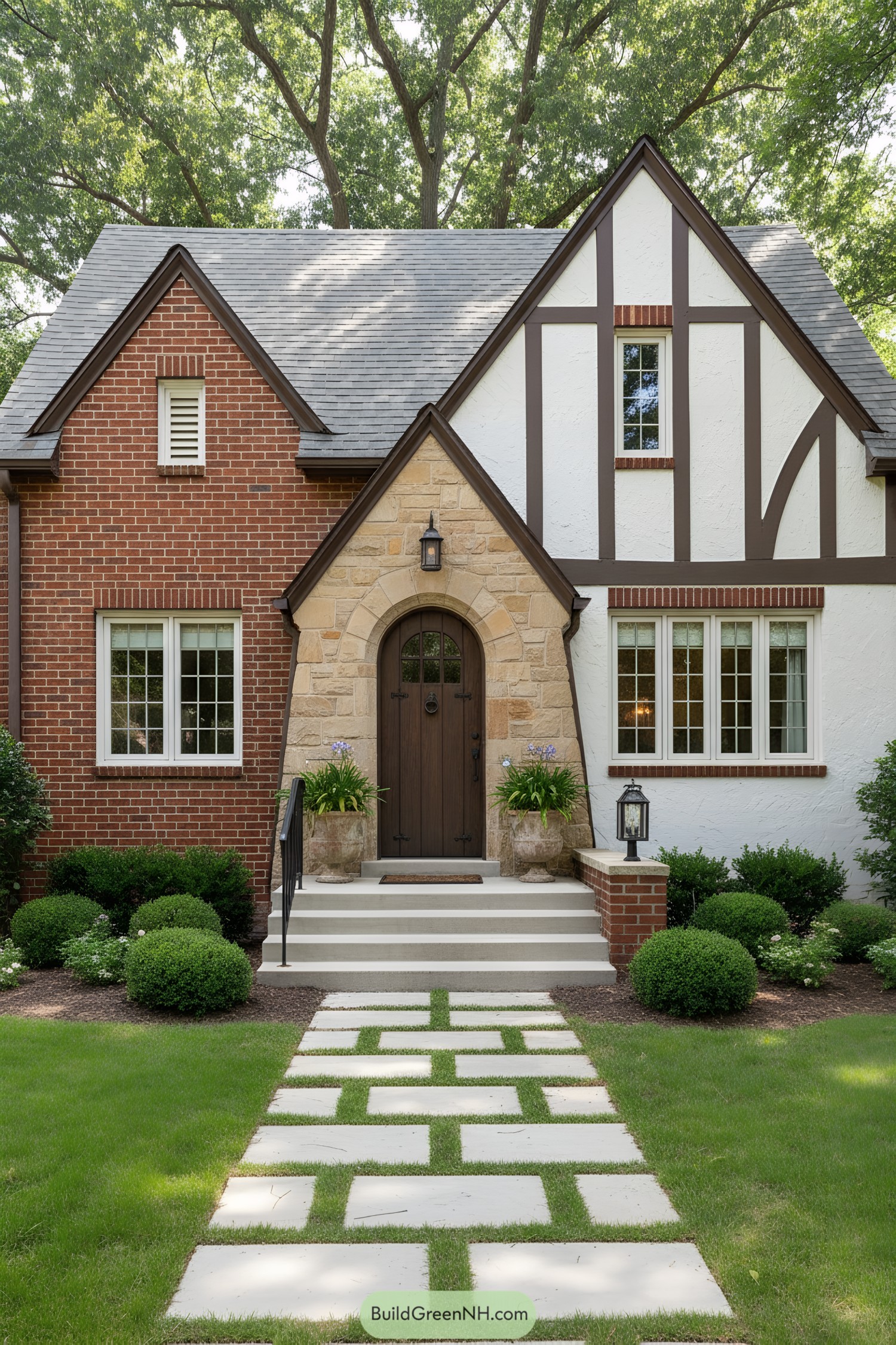 Compact Tudor cottage with brick, stone, and half-timber façade, arched wood door, and patterned paver path