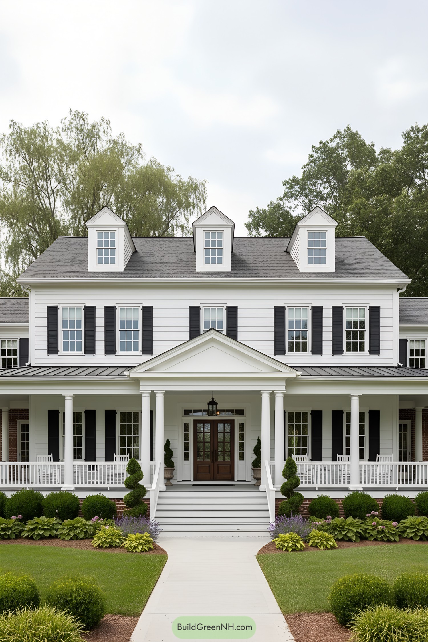 White clapboard colonial with dormers and wraparound porch