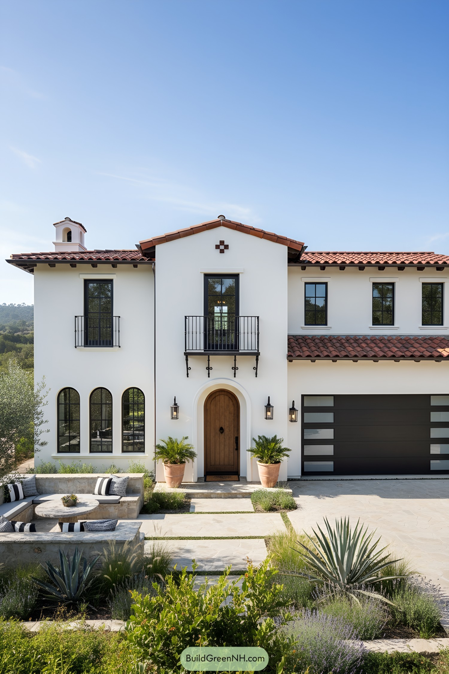Mediterranean-style house with terracotta roof and lush garden