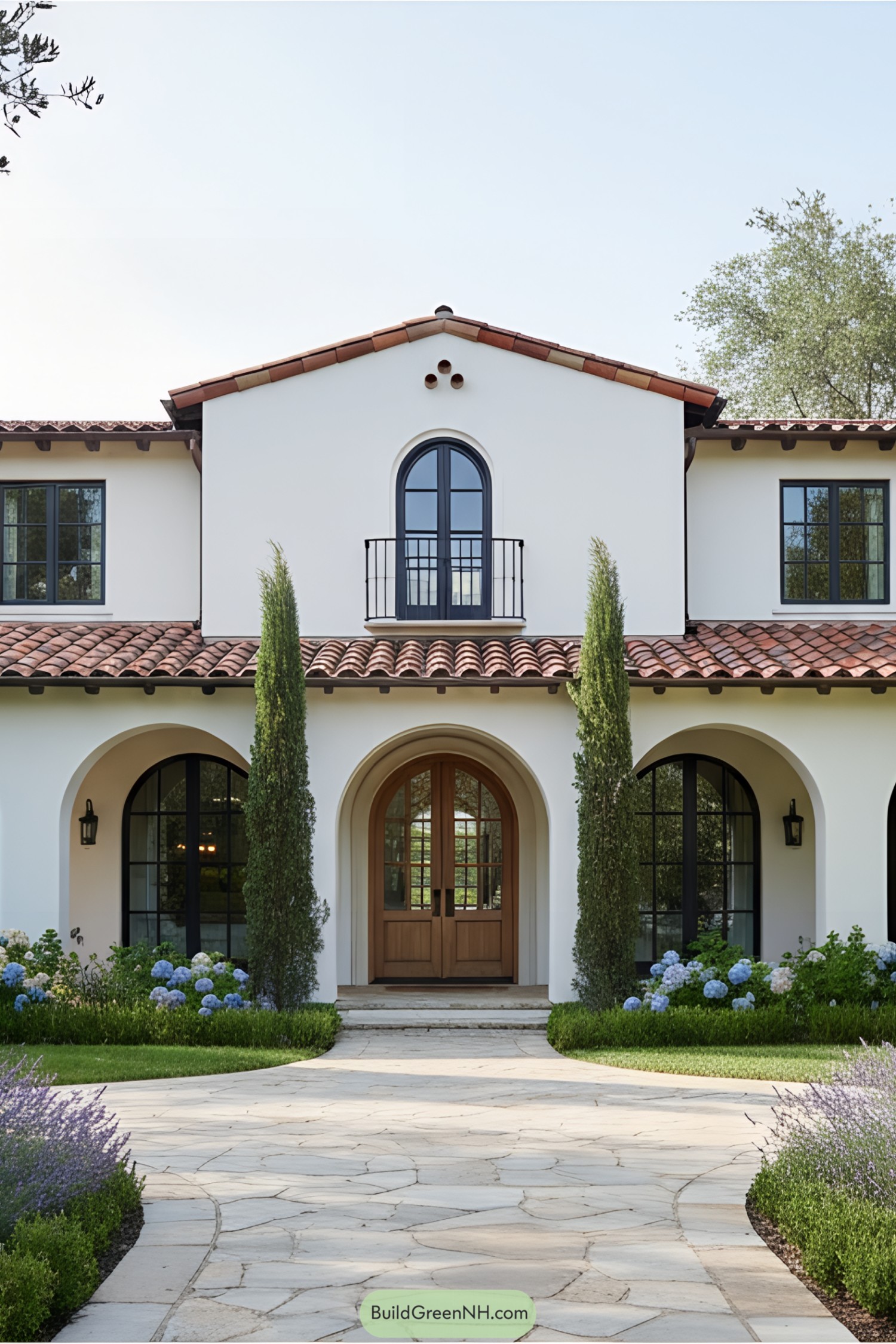 Spanish Mediterranean villa with arched windows and terracotta roof