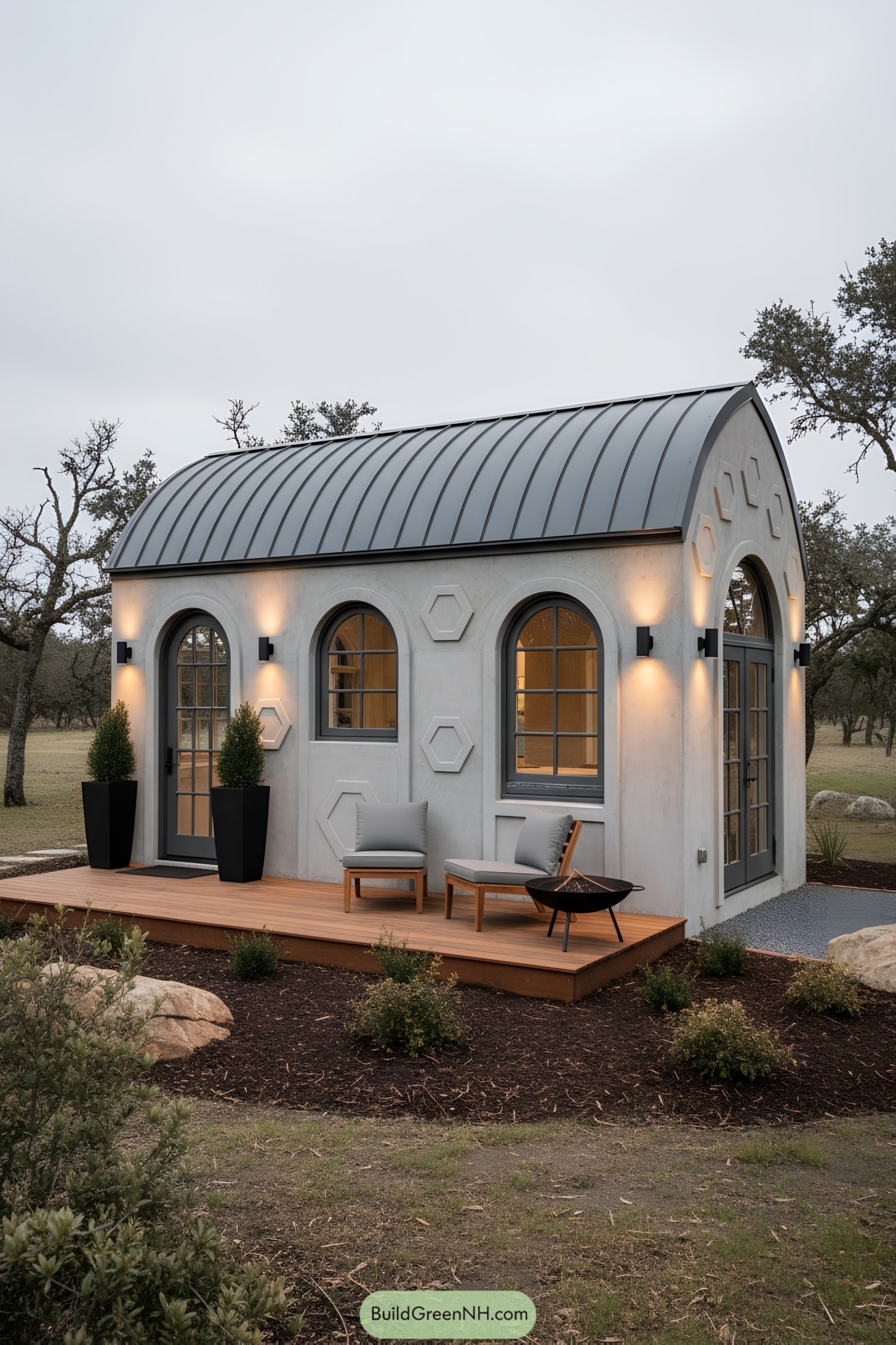 Arched-window concrete tiny house with barrel roof